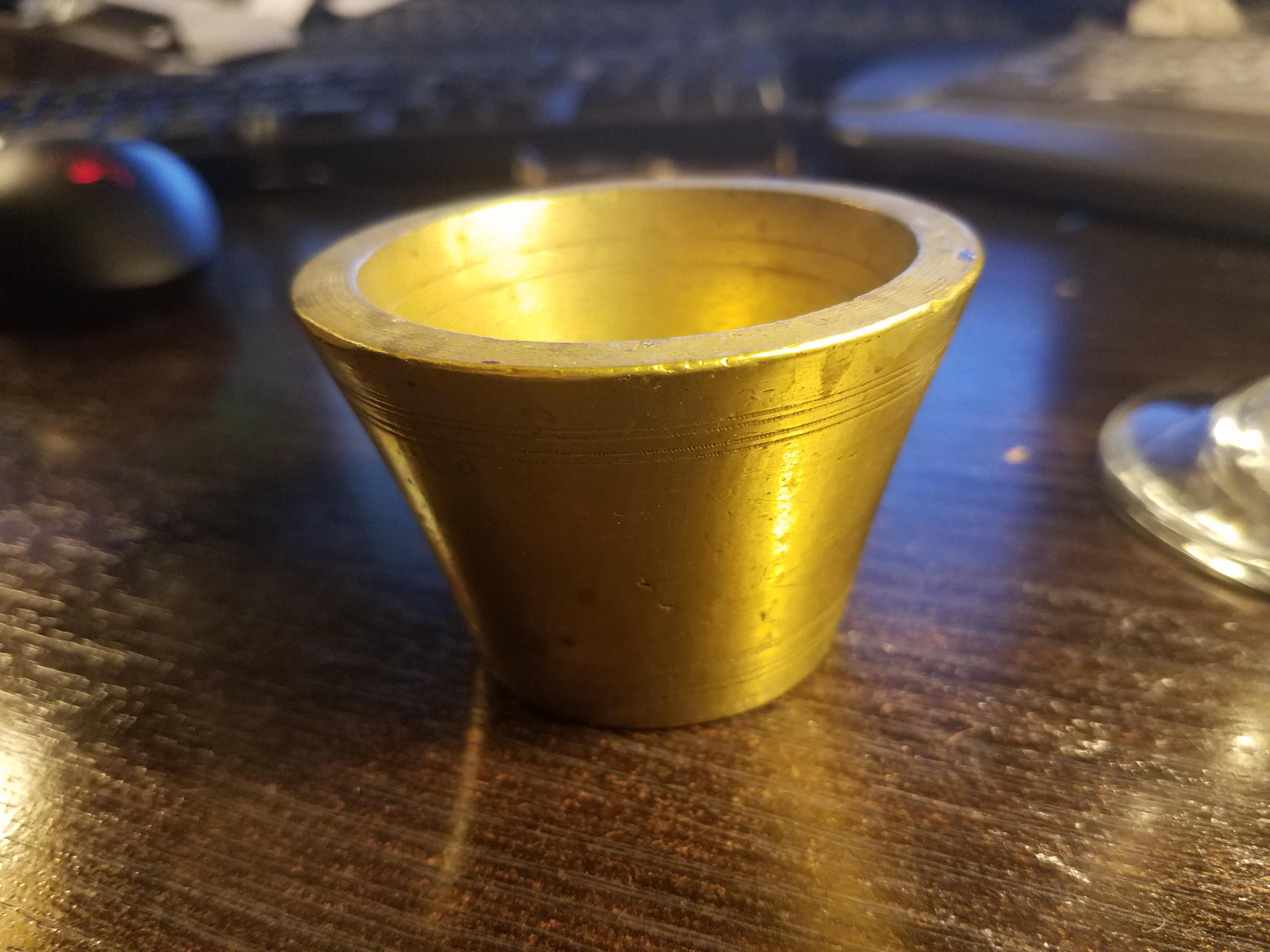 Brass? and heavy, found at auction r/whatisthisthing
