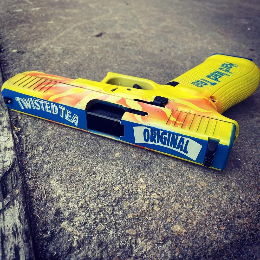 Custom "Twisted Tea" 5th Gen Glock 22. [Credit Evolved Tactical Gun