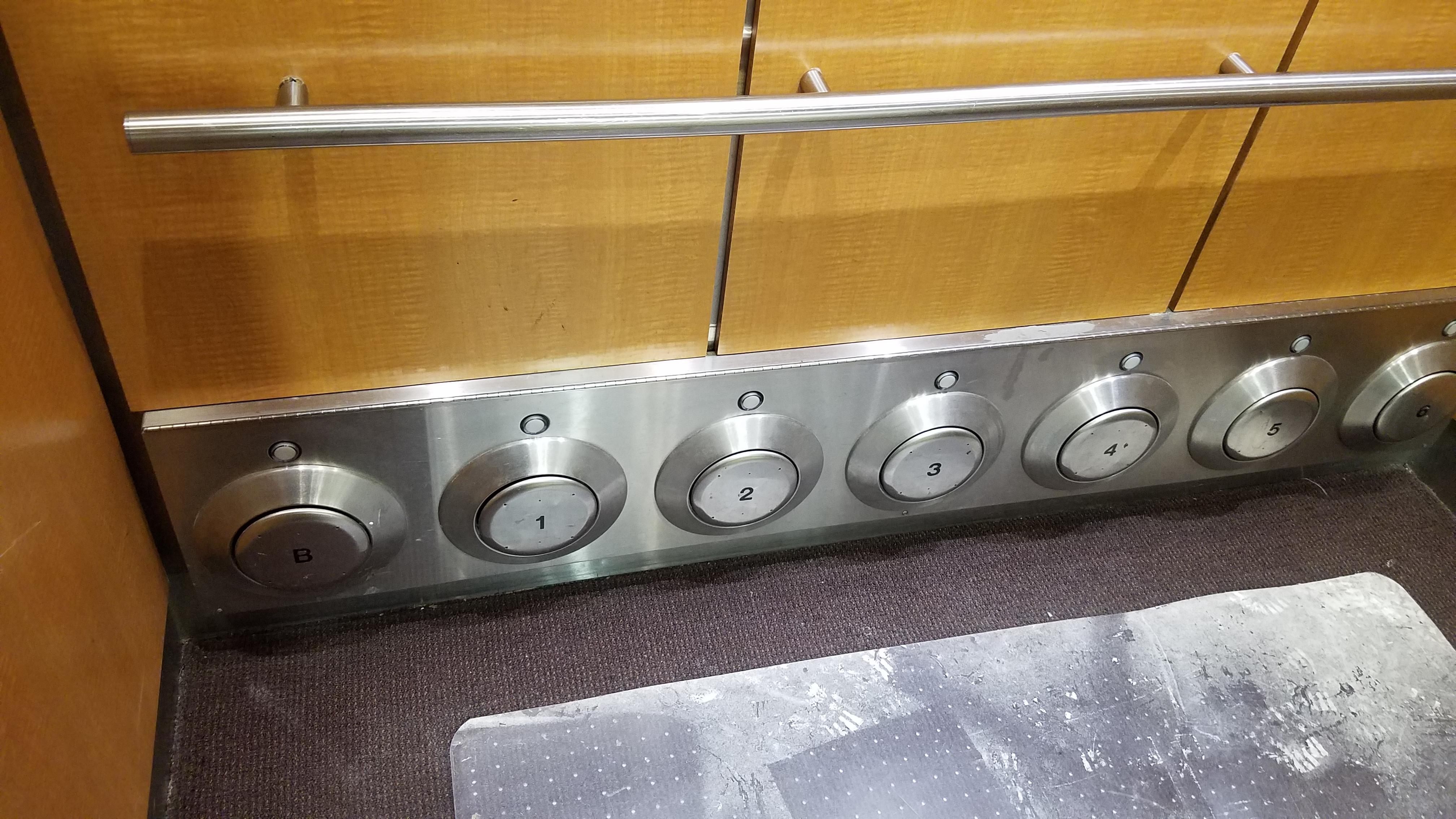 This elevator has fun foot buttons for people who can't reach the wall