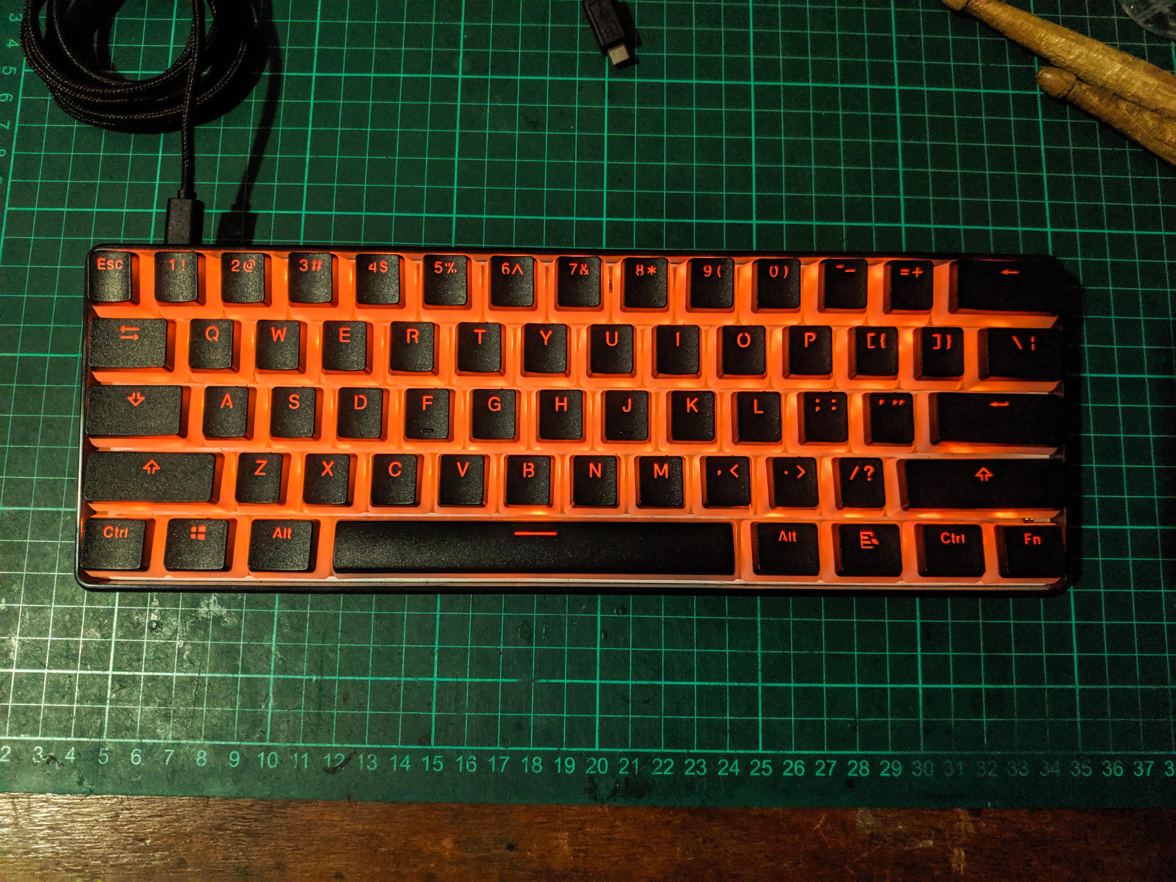 Gk61 with black pudding keycaps. Using modded kailh speed bronze