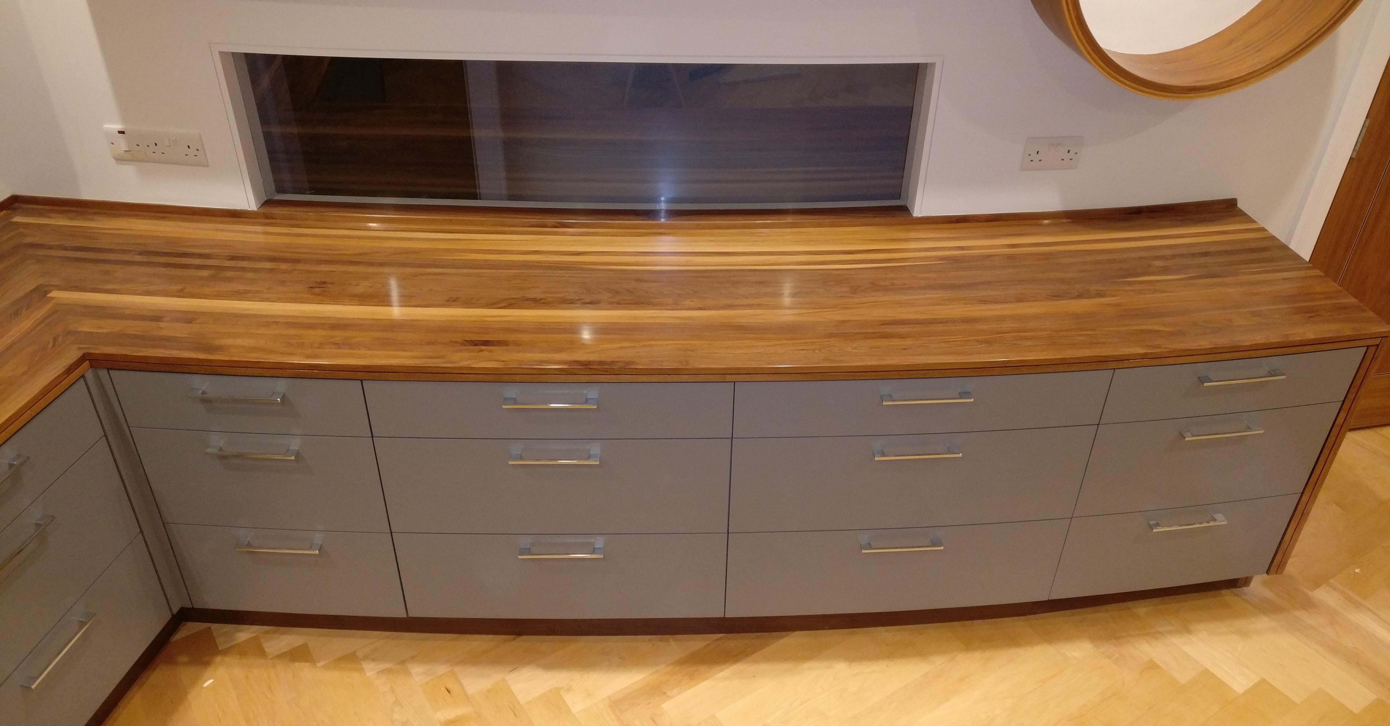 Curved Kitchen, laminated walnut worktop. I decided not to join left