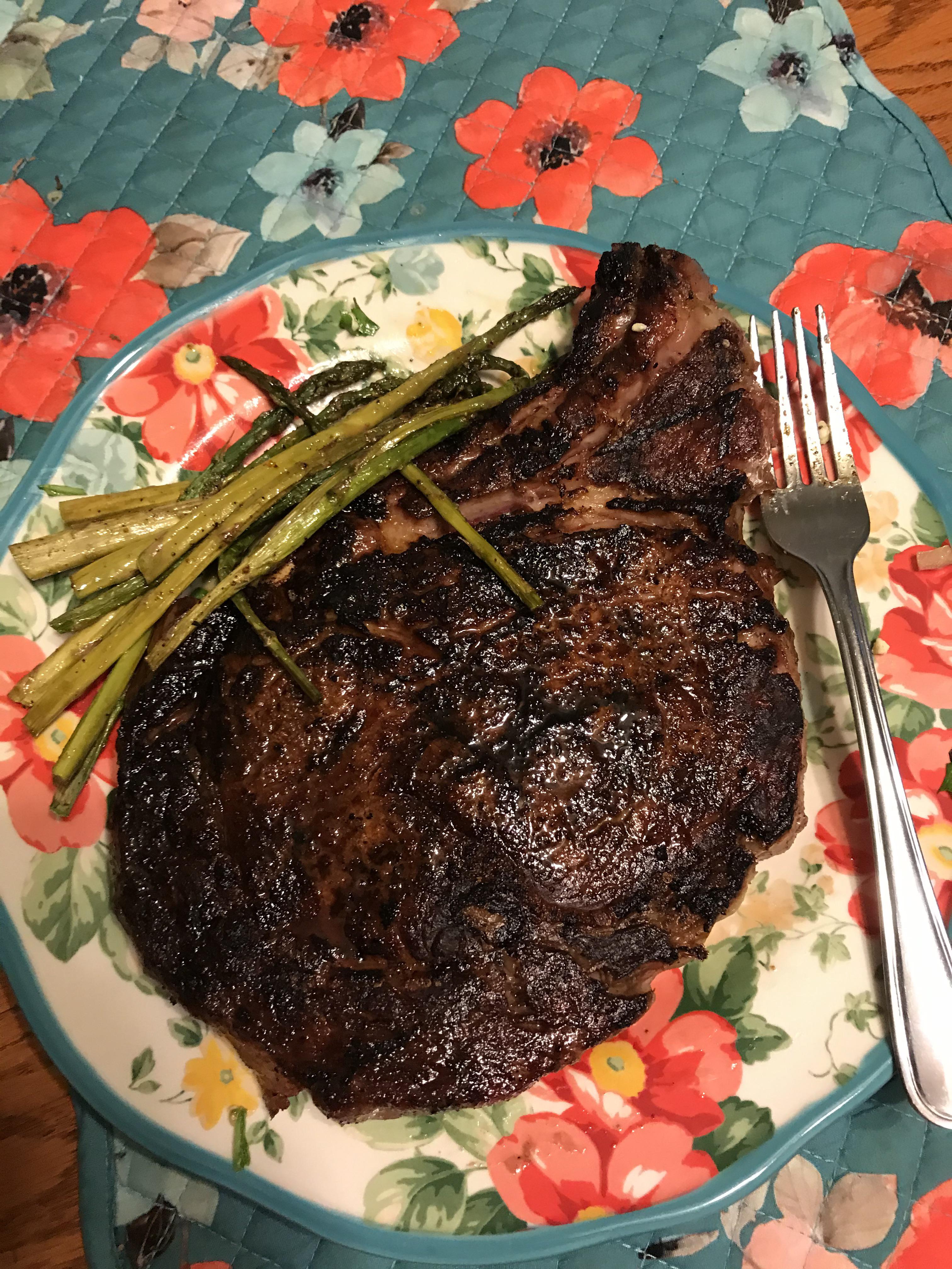 Massive ribeye, looks pretty charred but it was perfectly rare
