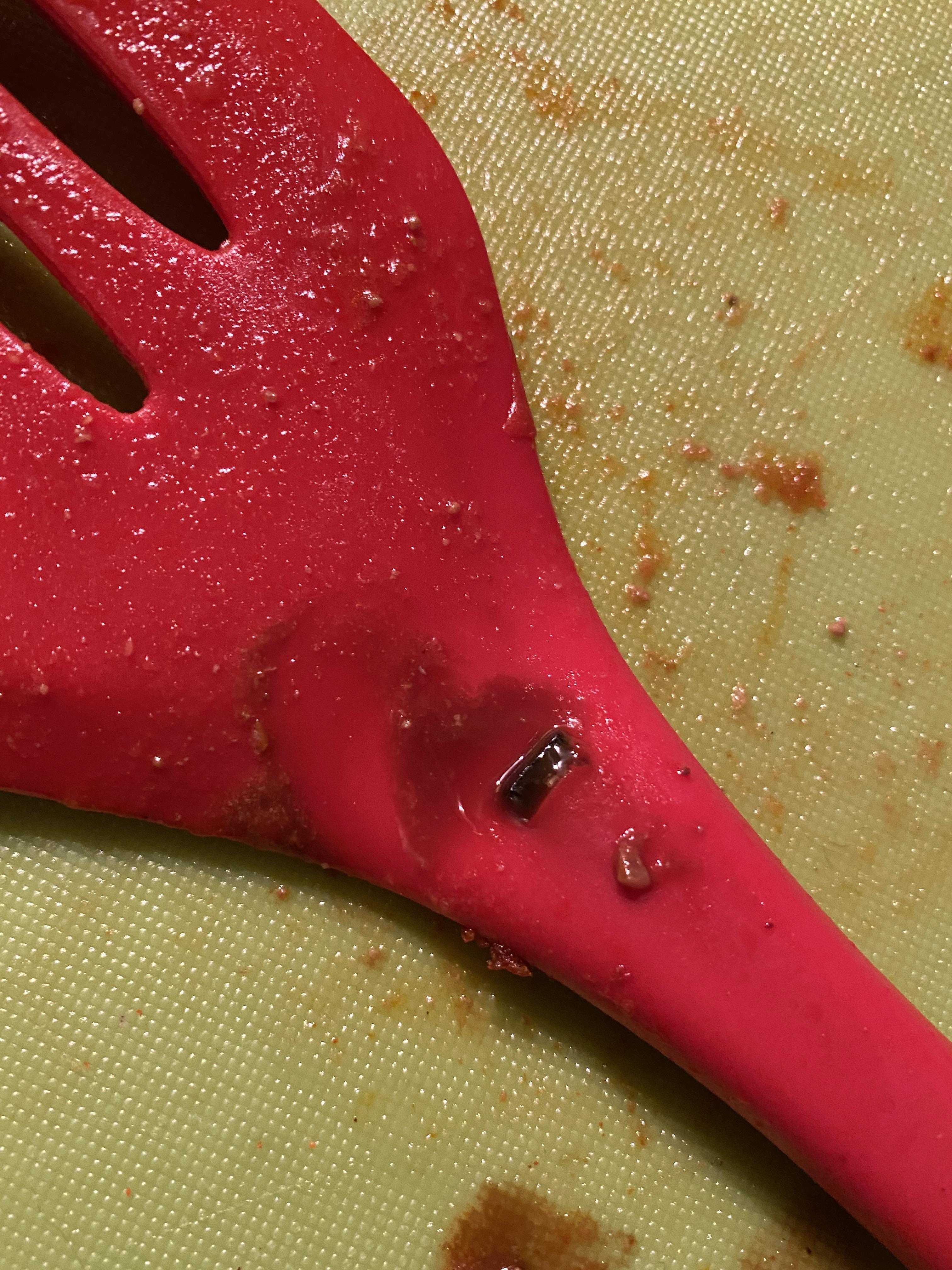 Should I throw out chilli because of broken spatula leaking oil? r