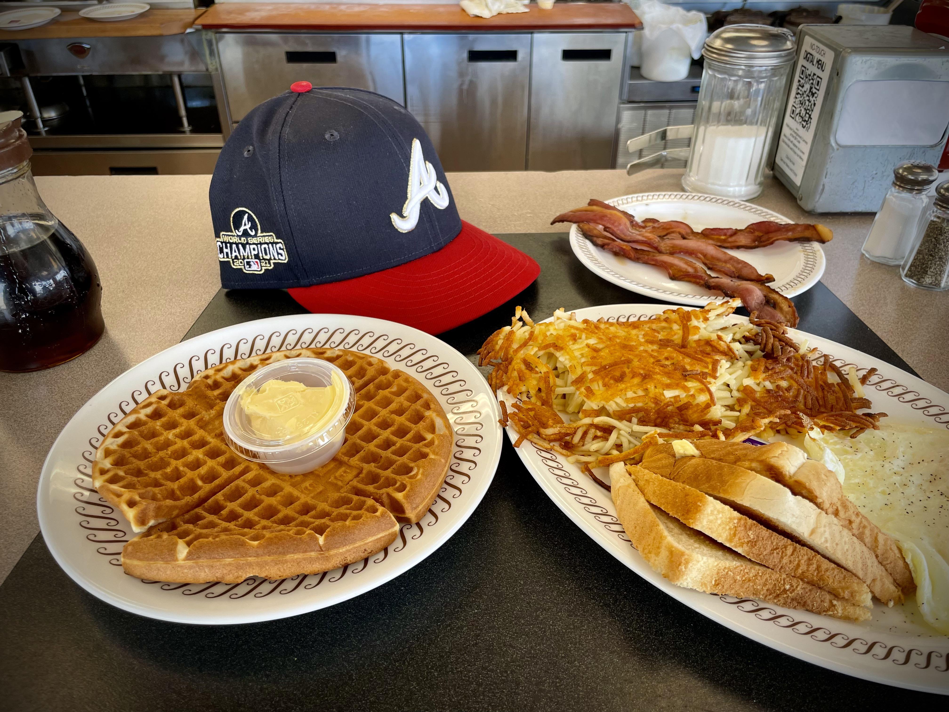 The pregame meal at Waffle House is even better with a gold trim hat