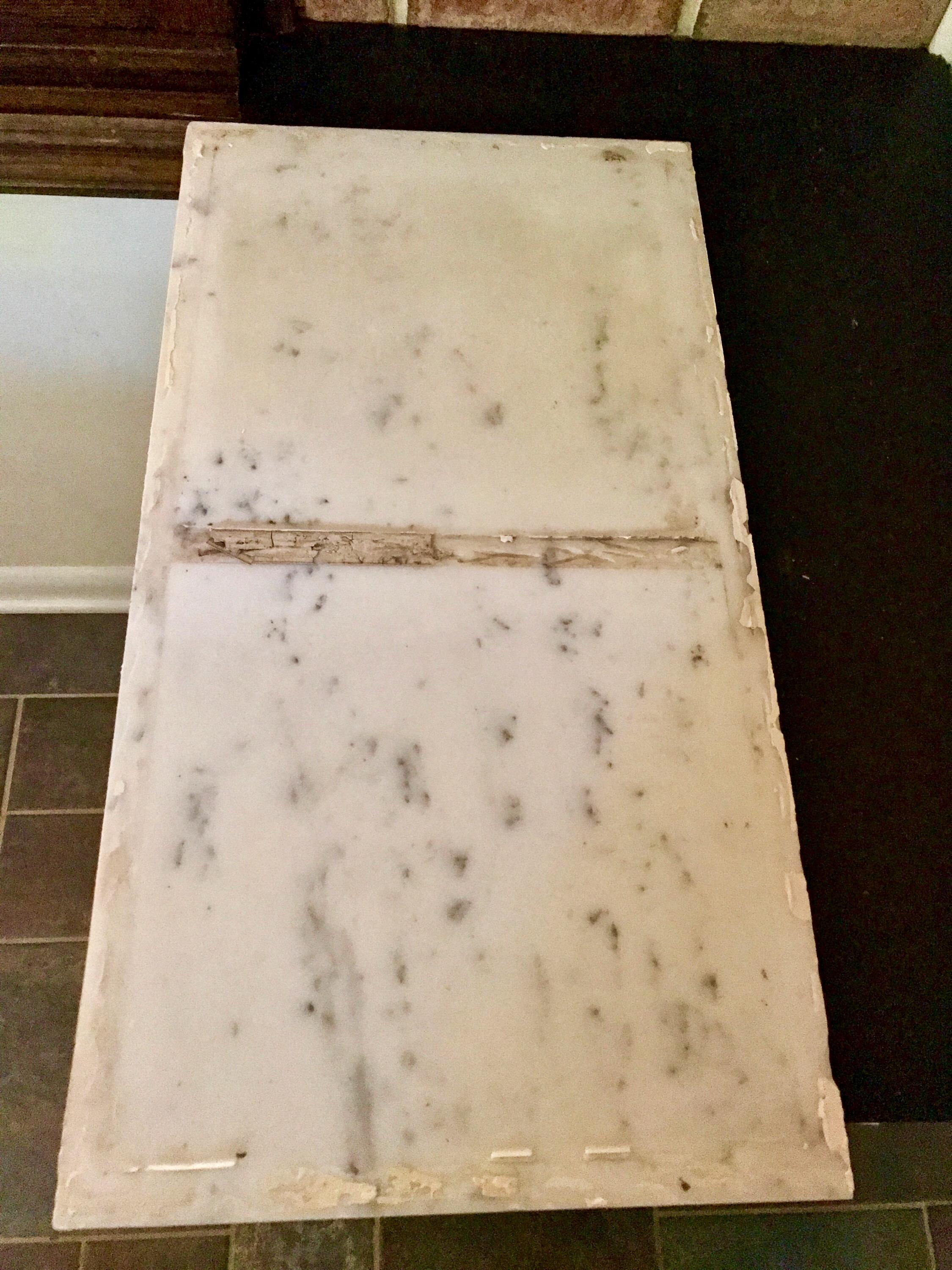 How do I clean off the adhesive residue from this leftover marble slab? I plan on making a small