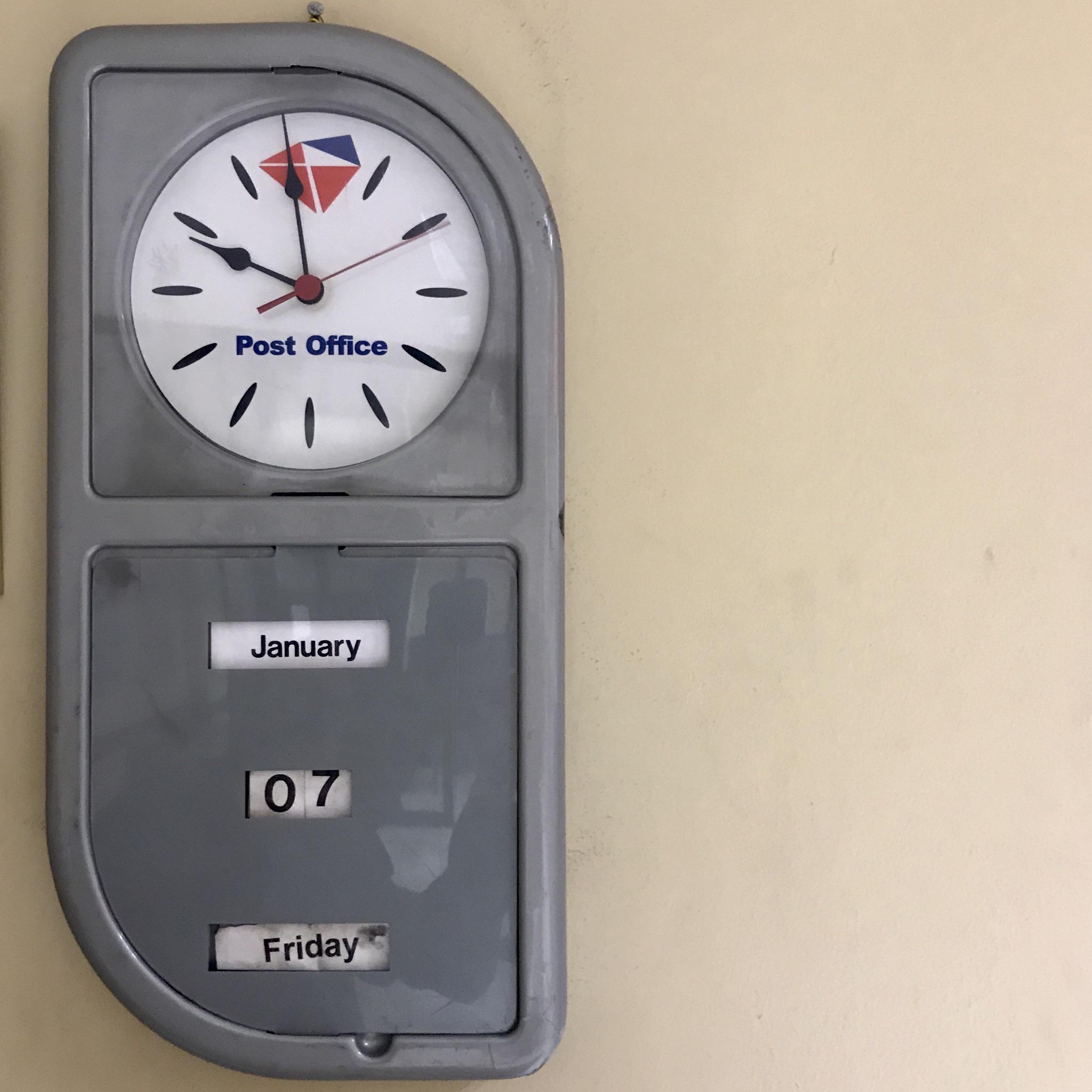 ITAP of a plastic wall clock at the post office near home. Illovo, Johannesburg r/johannesburg