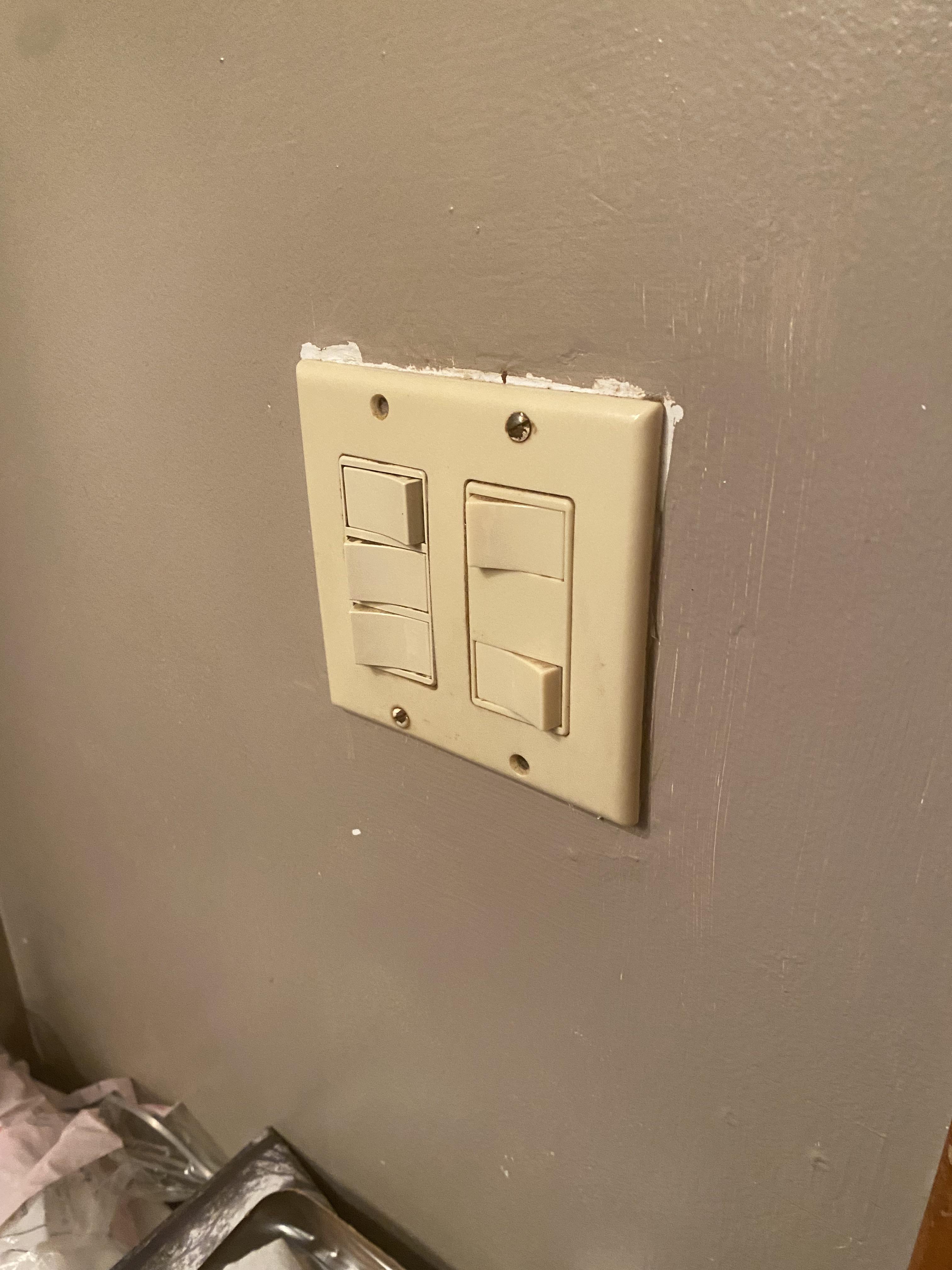 At my house the light switch panel is very old, and the topmost left switch keeps flicking back