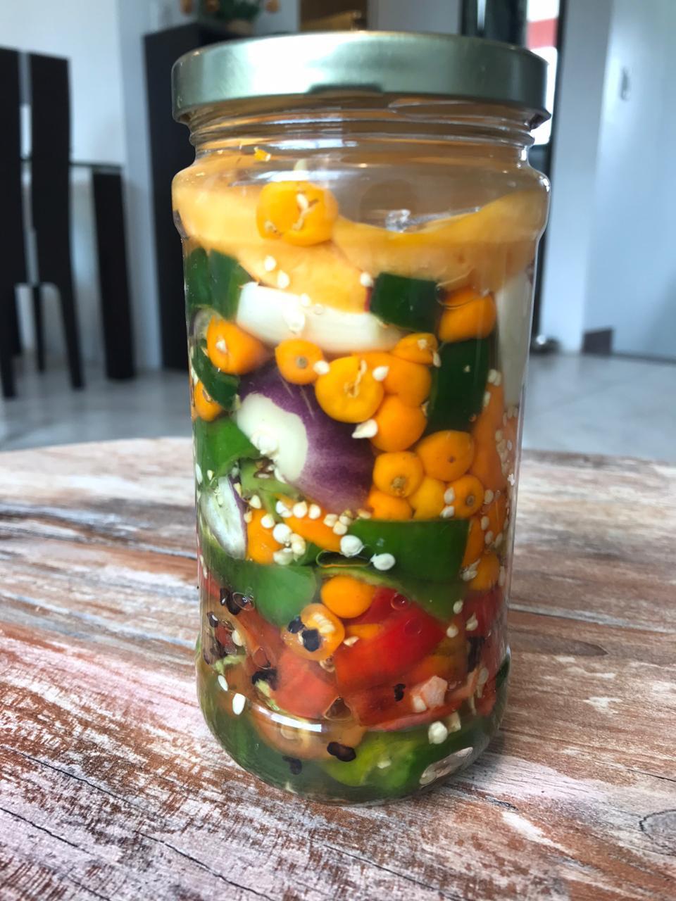 An assortment of Peruvian Jungle chillis, garlic, and peach. Excited