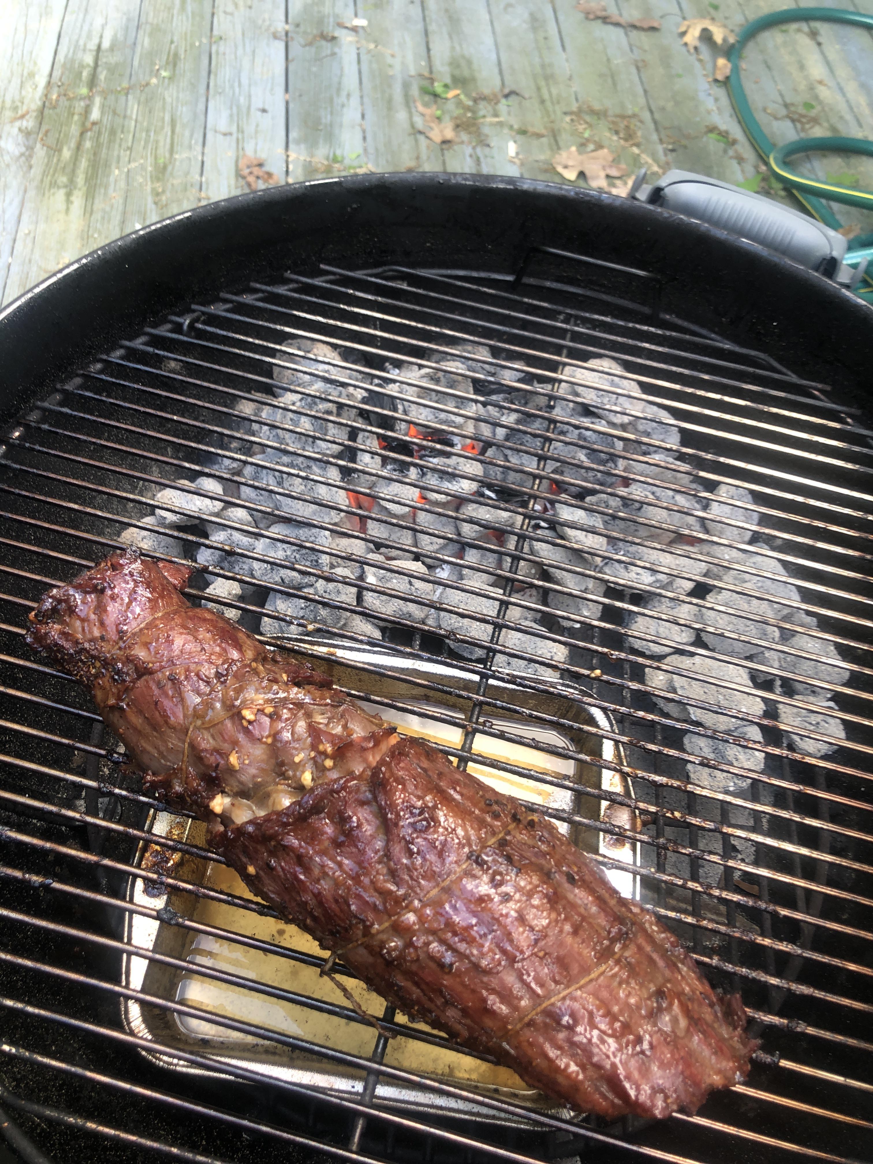 Marinated skirt steak with prosciutto and feta rolled in the middle