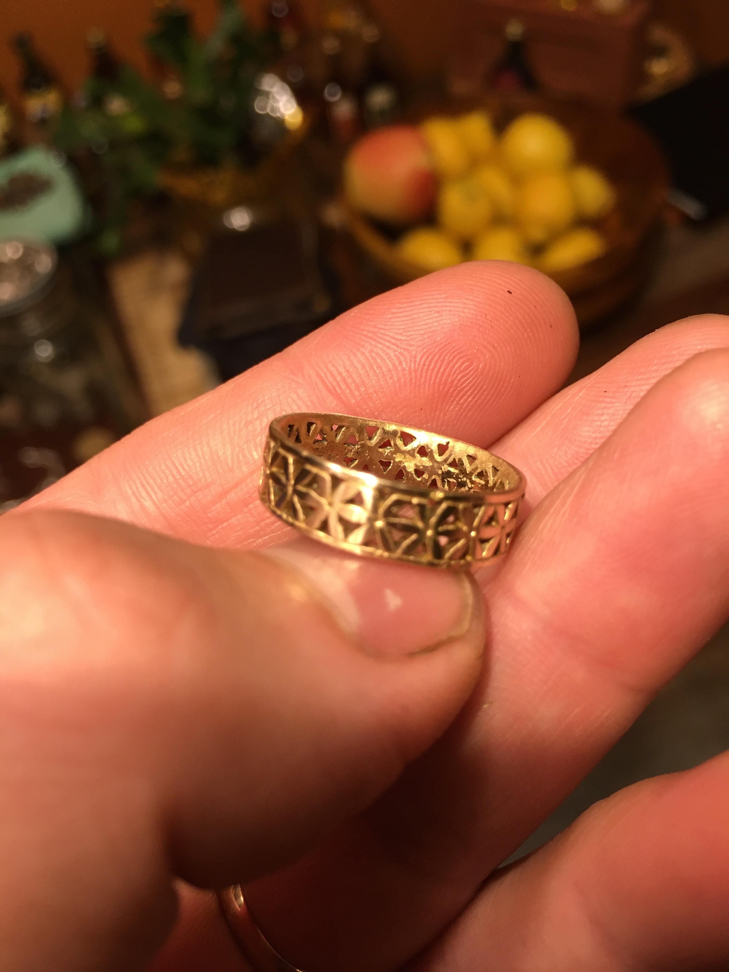 Is it gold? No hallmark. No rust or anything. Just a super small green