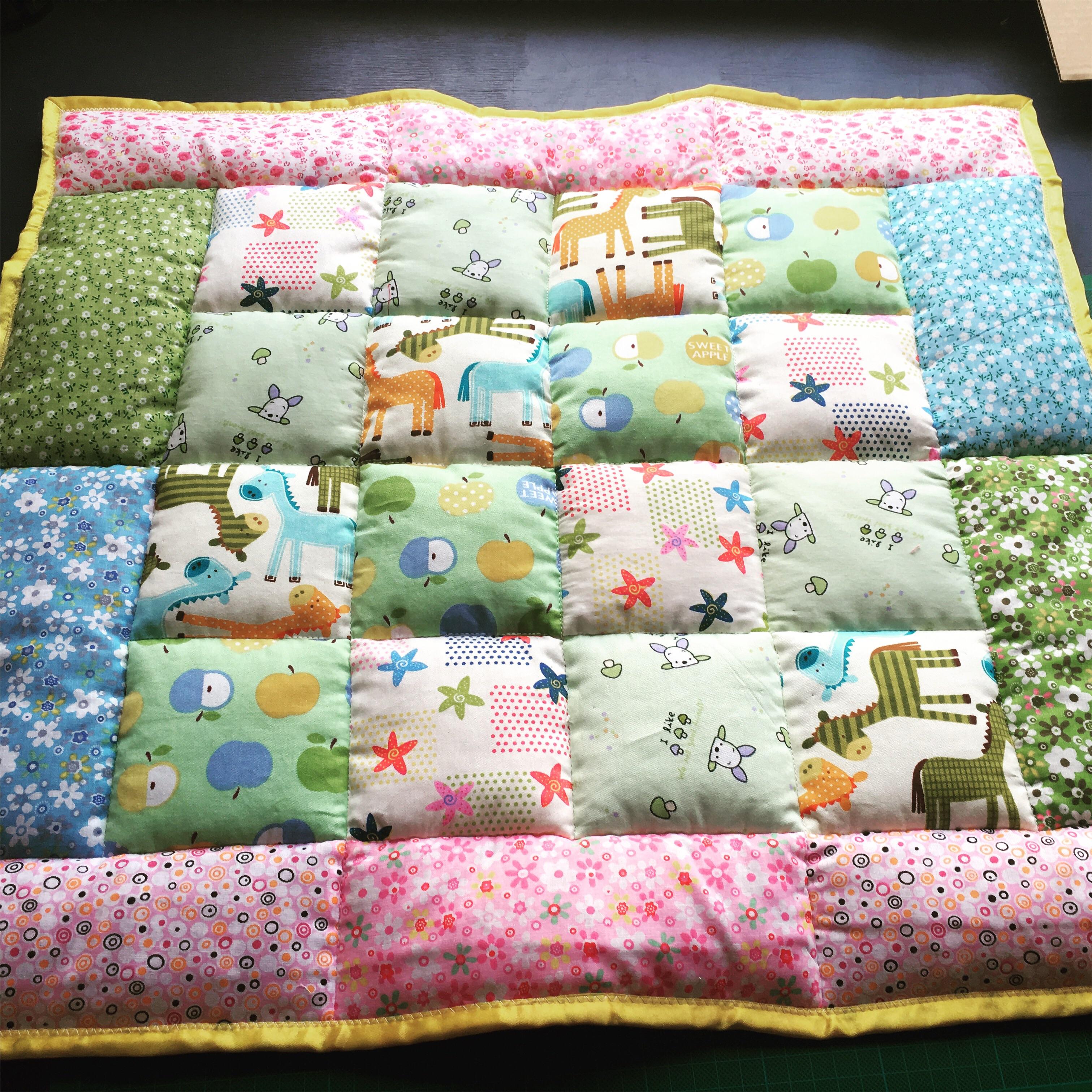 A padded mat for babies tummy time. A bit hard to sew through all the