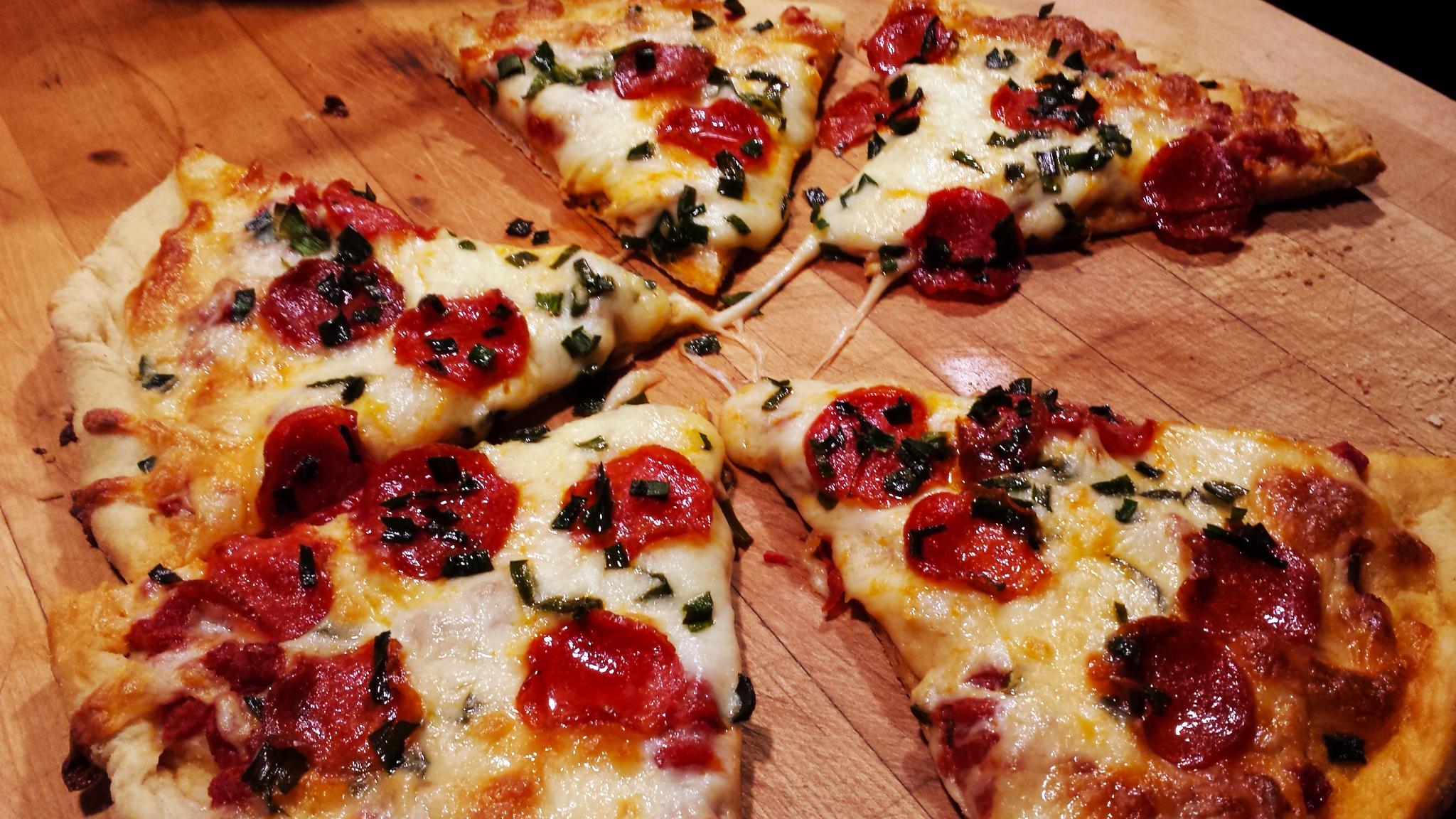 Homemade pepperoni and green onion pizza. The green onion got a bit