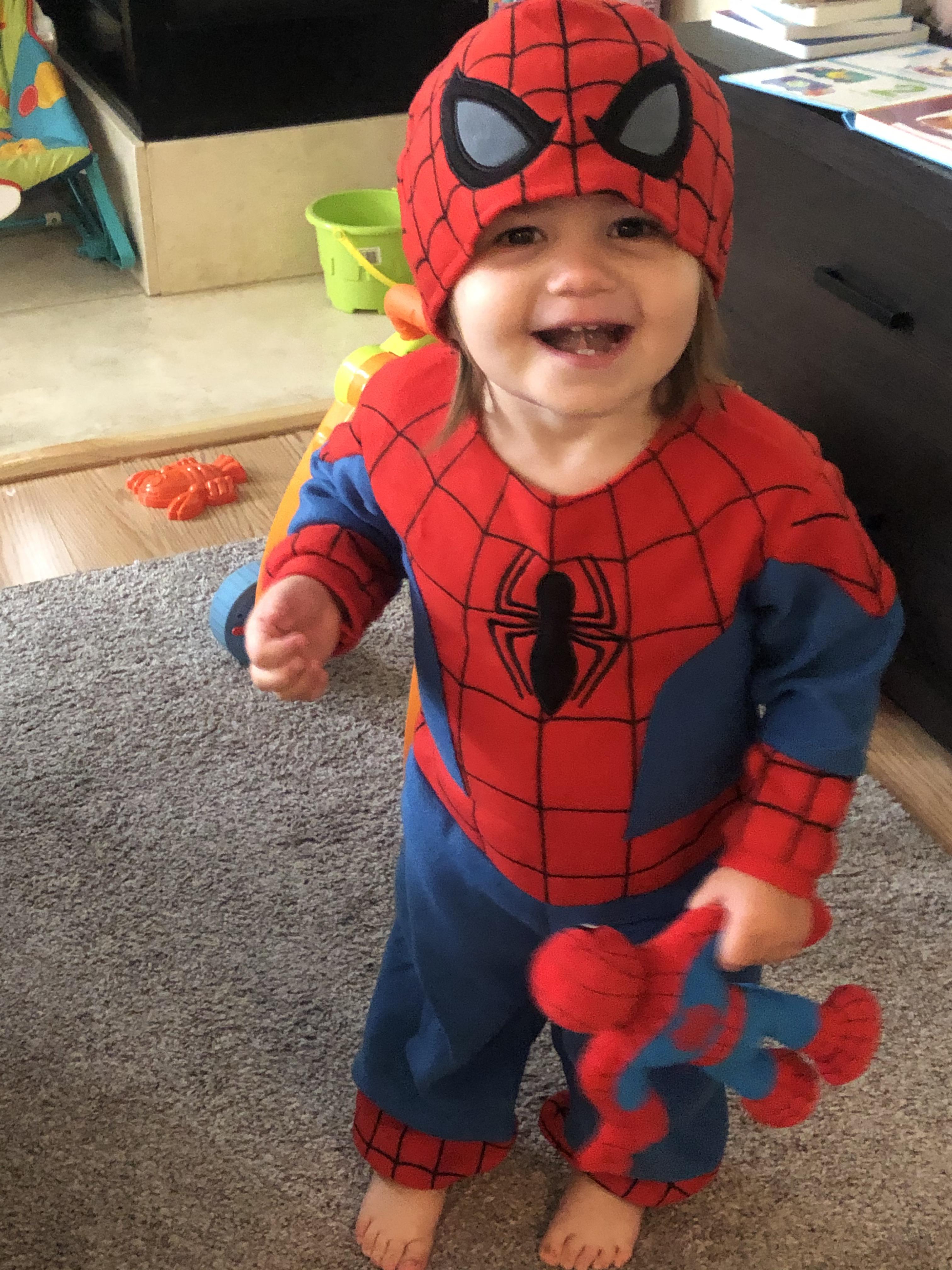 Baby girl wants to be SpiderMan for Halloween. Trying on her new