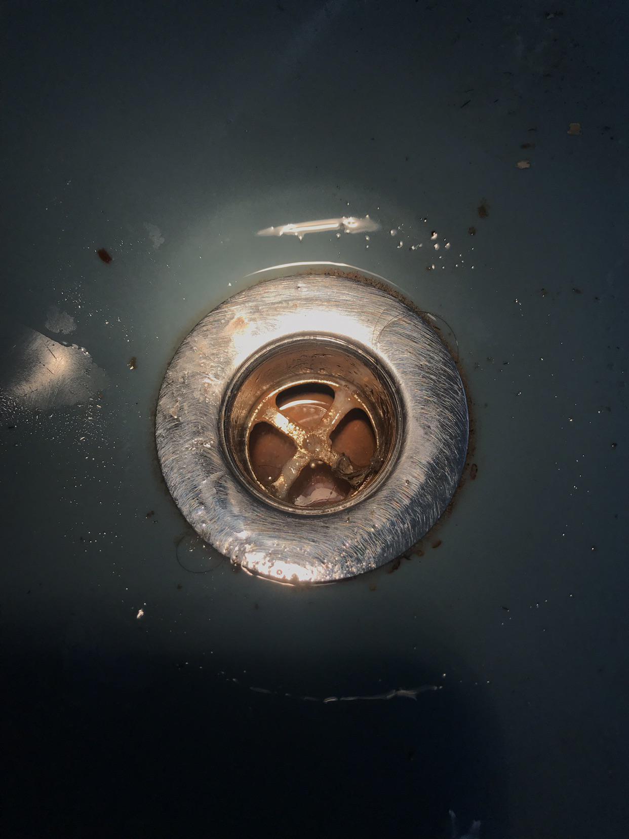 Shower Drain Clogged with Hair and this Hard Orange/Brown Material (tried baking soda/vinegar