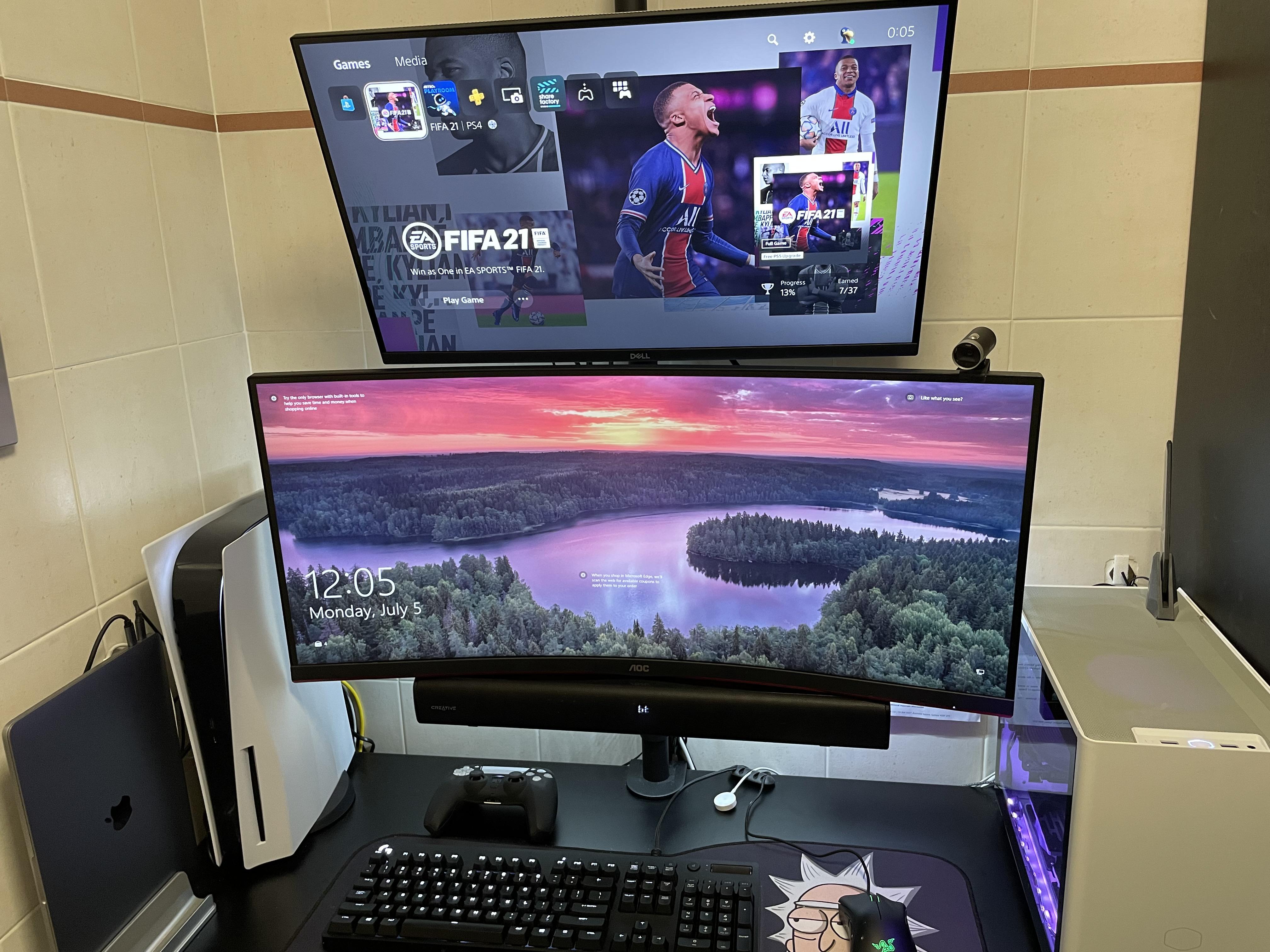 Vertical monitor setup with a Creative Stage 2.1 Soundbar mounted on