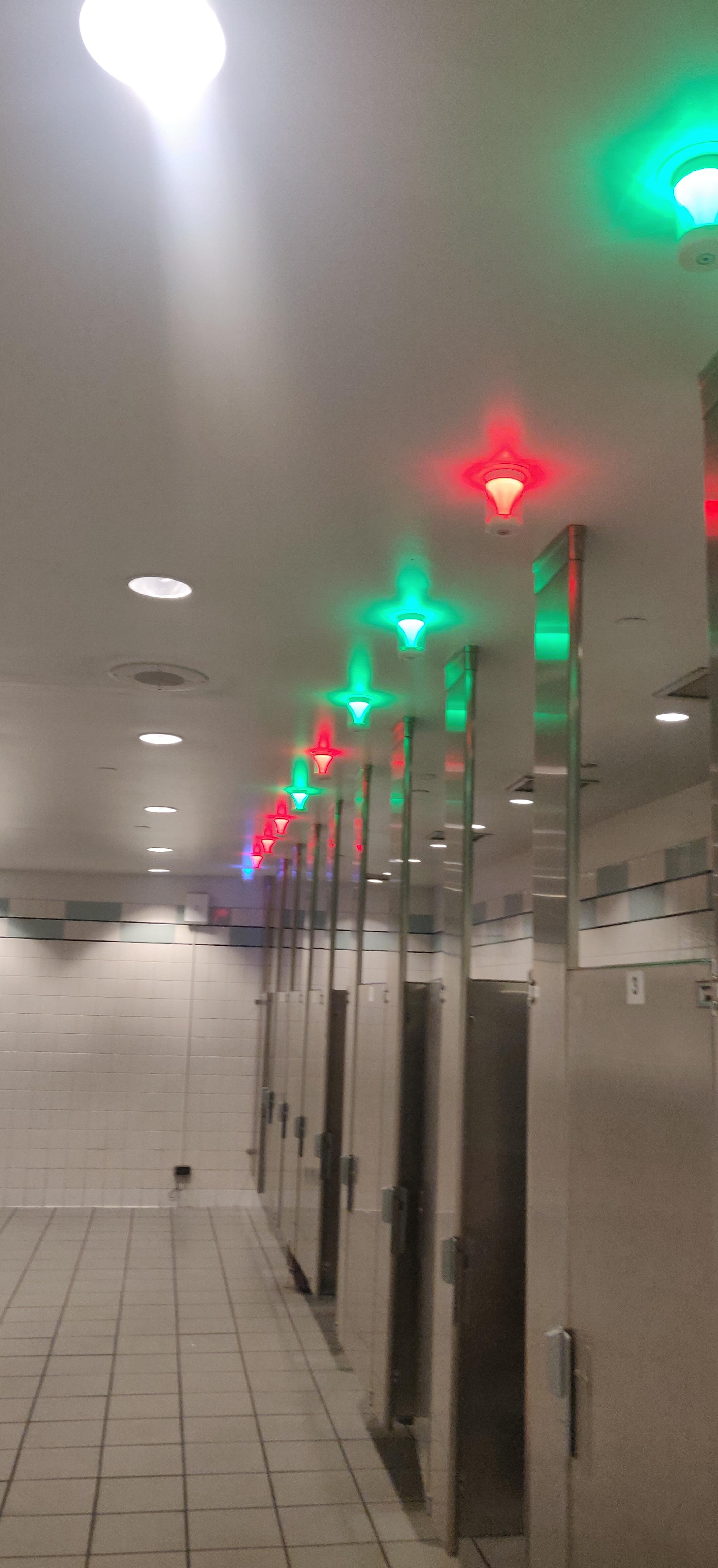 The lights in this bathroom tell whether it is occupied or not r