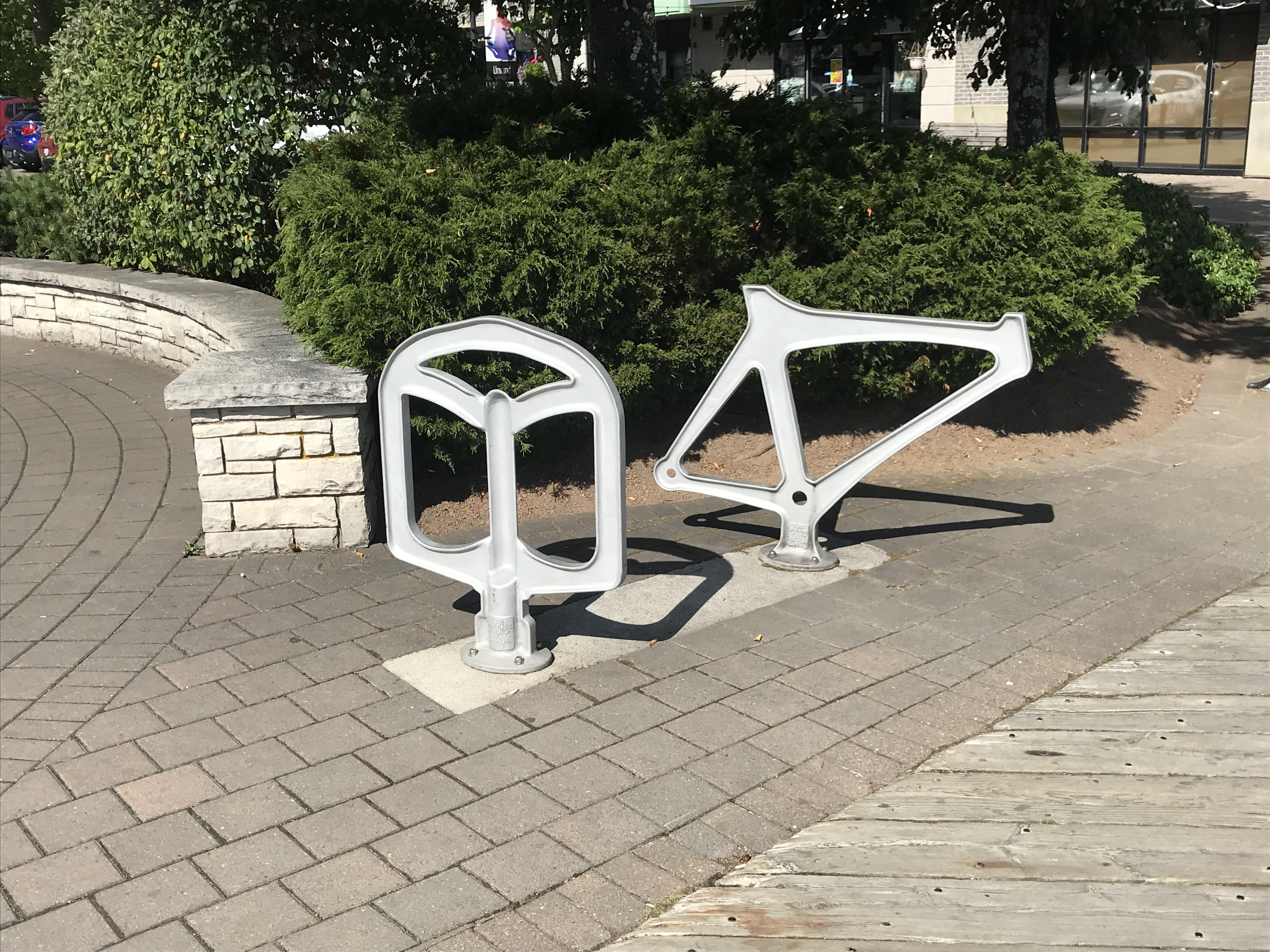 The bike racks on the Halifax boardwalk are shaped like bike parts. r