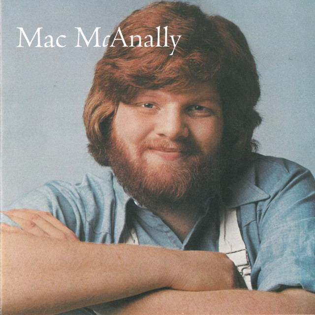 Mac McAnally It's a Crazy World Lyrics Meaning Lyreka