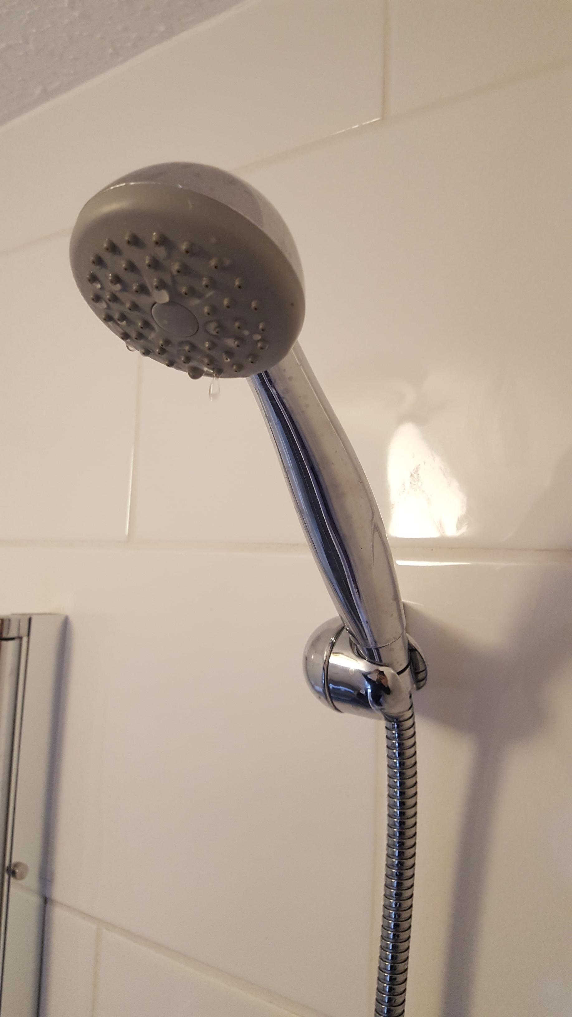 bathroom How can I tighten my shower head holder so that it doesn't