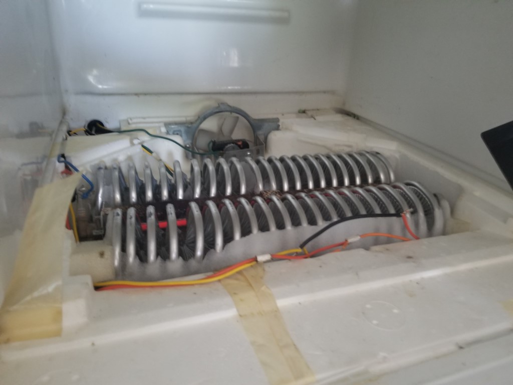 refrigerator iced up pipe on the back of the fridge Home