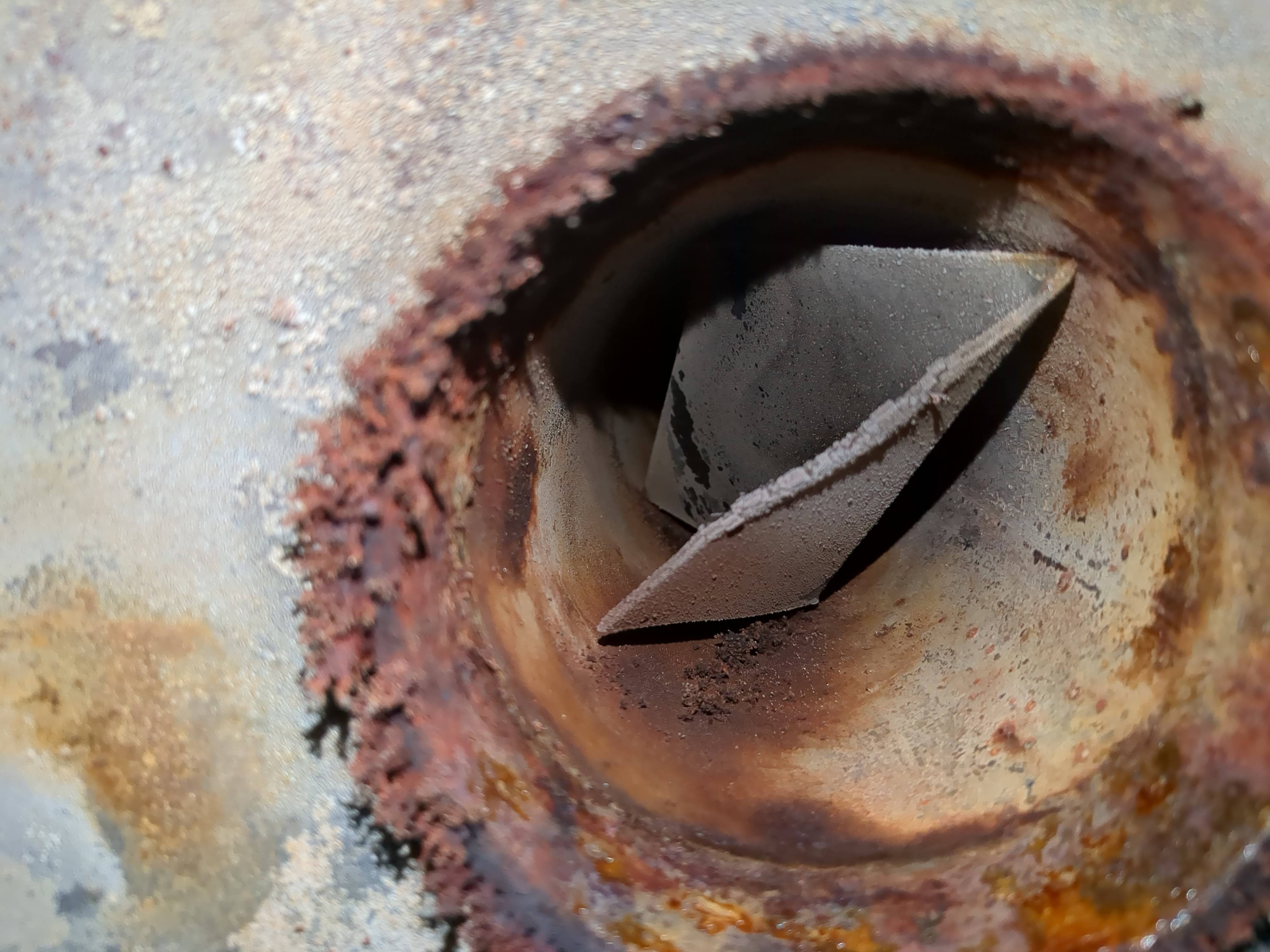 What is this metal object inside the hot water tank vent? Home Improvement Stack Exchange