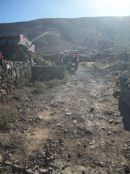 concrete Stabilizing a gravel driveway with massive holes and steep inclination Home