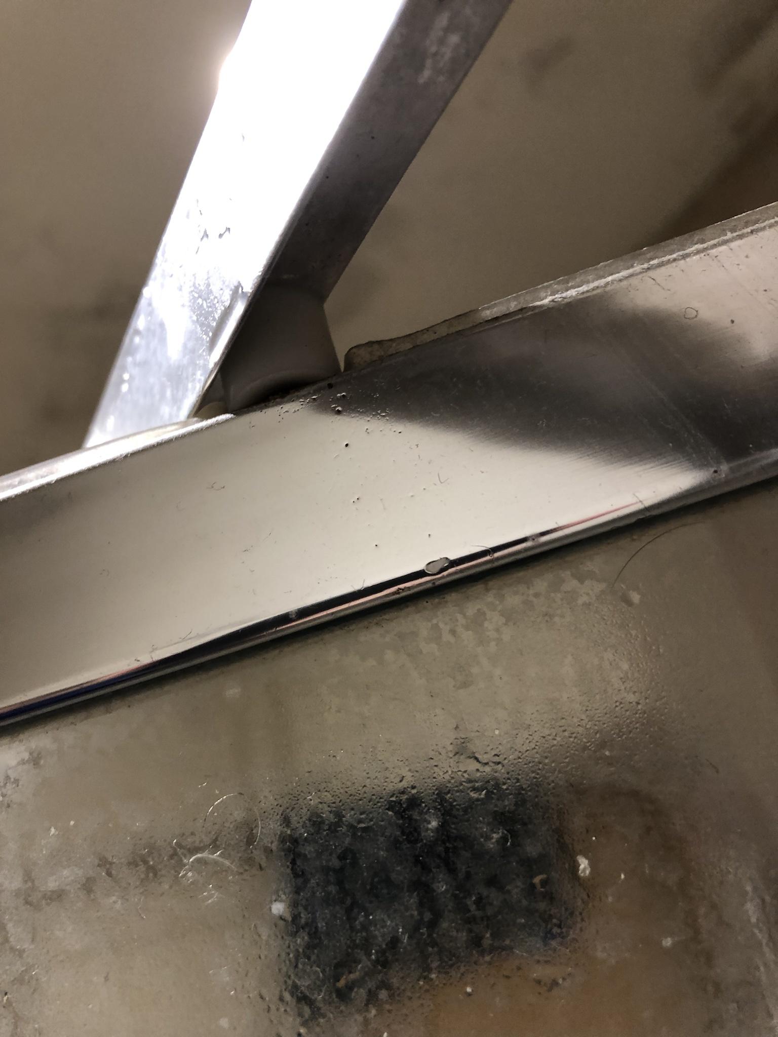 bathroom Sagging shower door with pivot point away from the wall