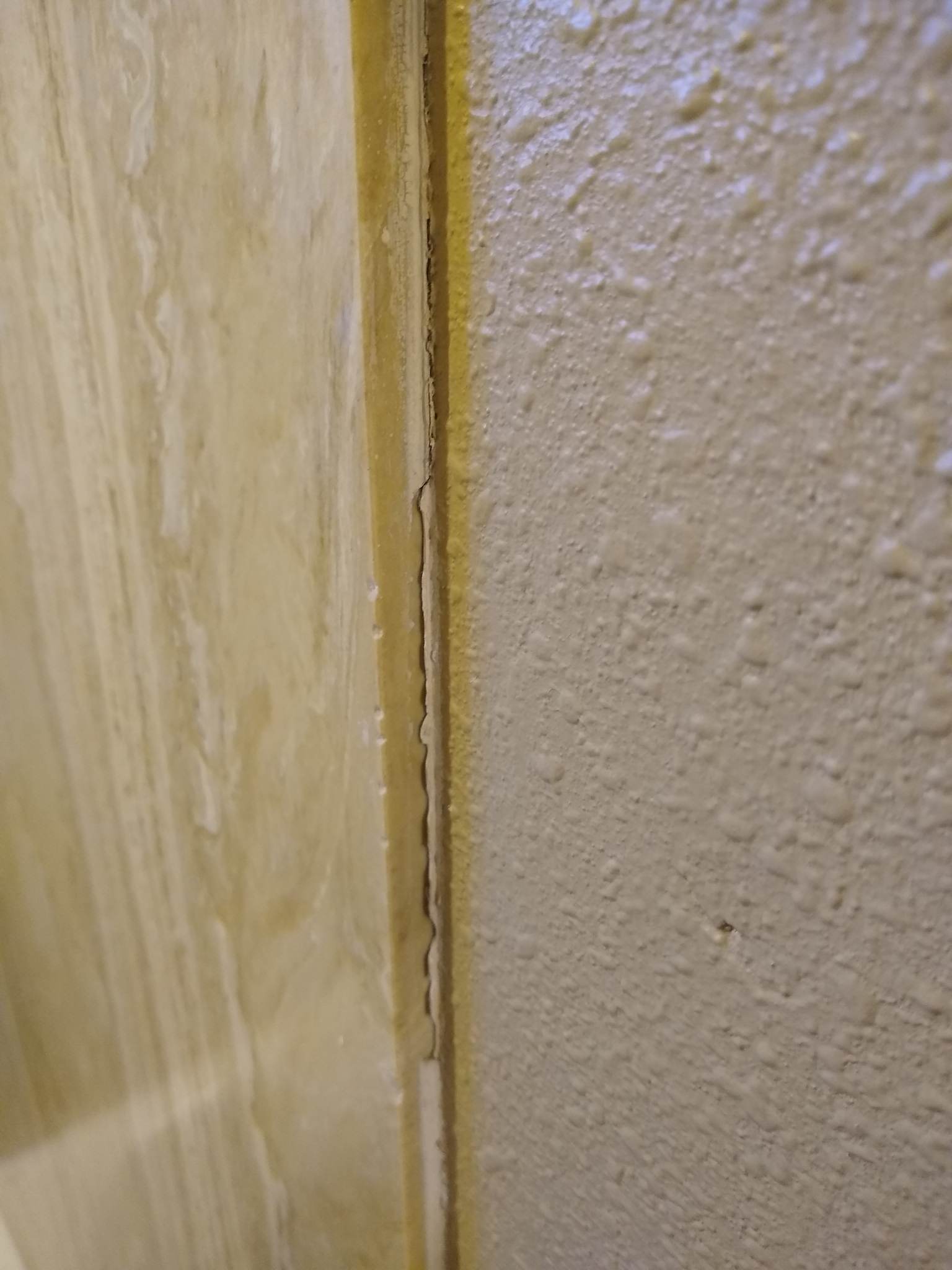 drywall What's the best caulk for the interface between shower wall