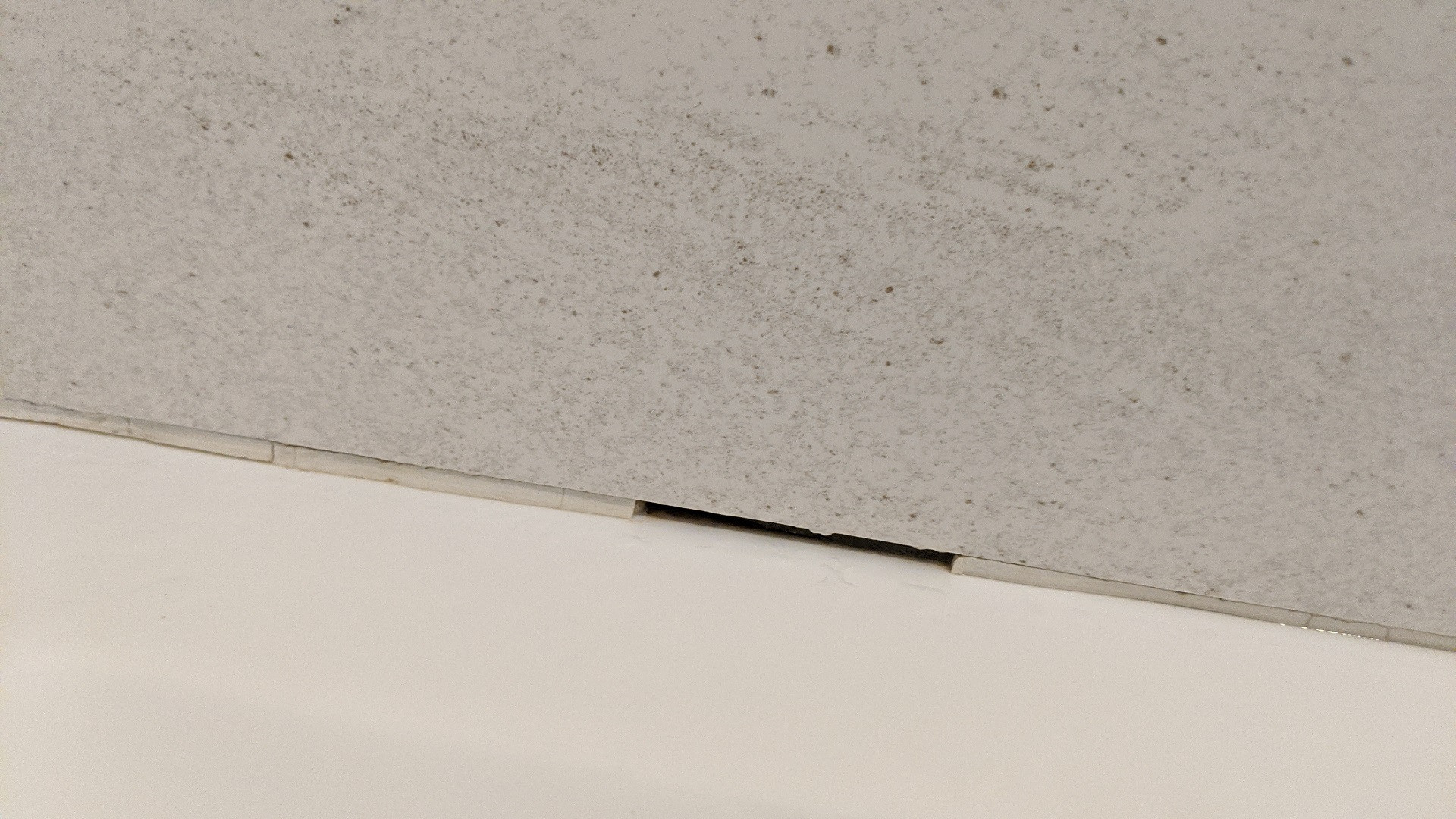 waterproofing REPAIR Bathtub caulking or grouting between acrylic