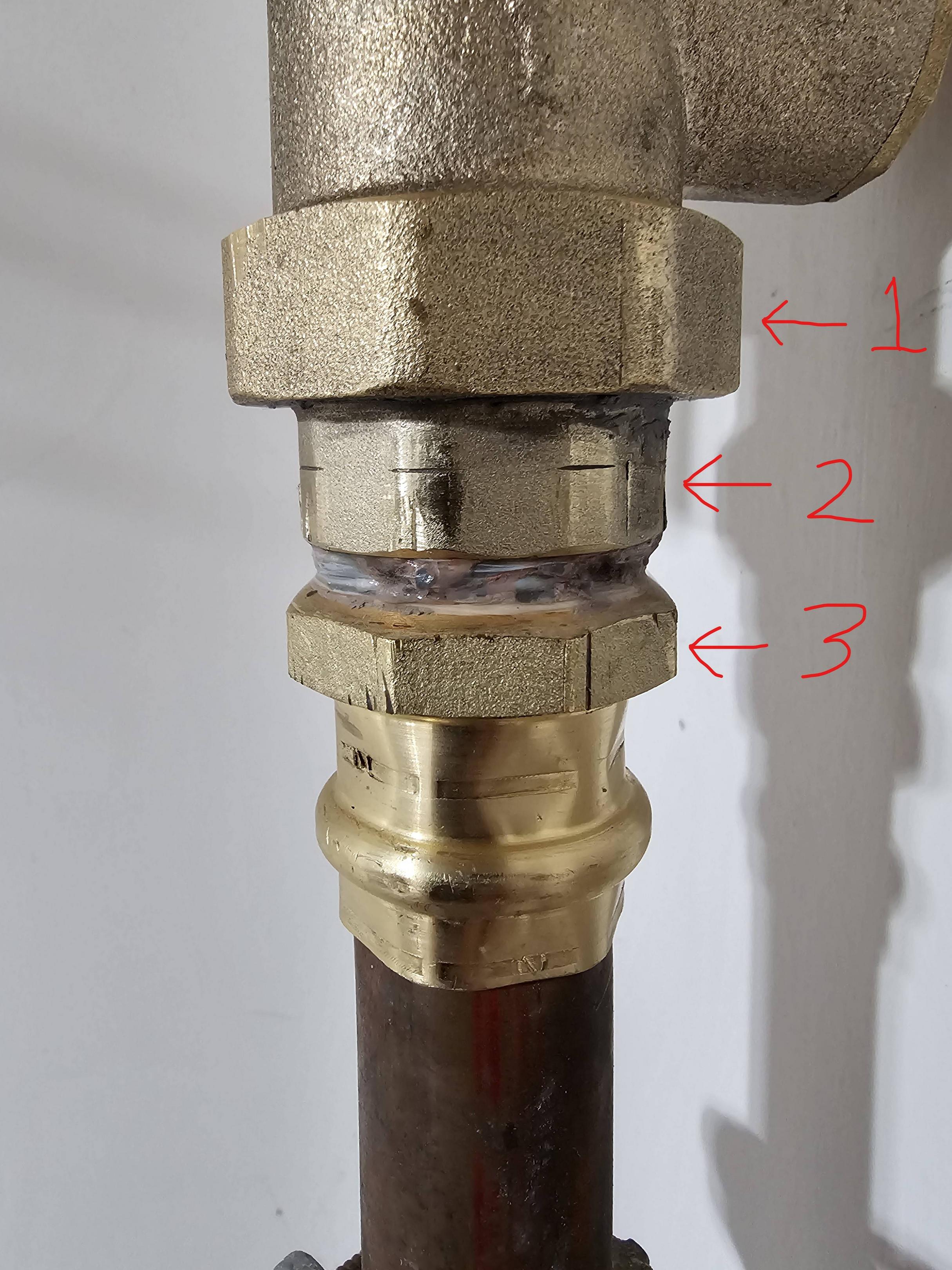 water How do I tighten this type of plumbing connection on a pressure regulator? Home