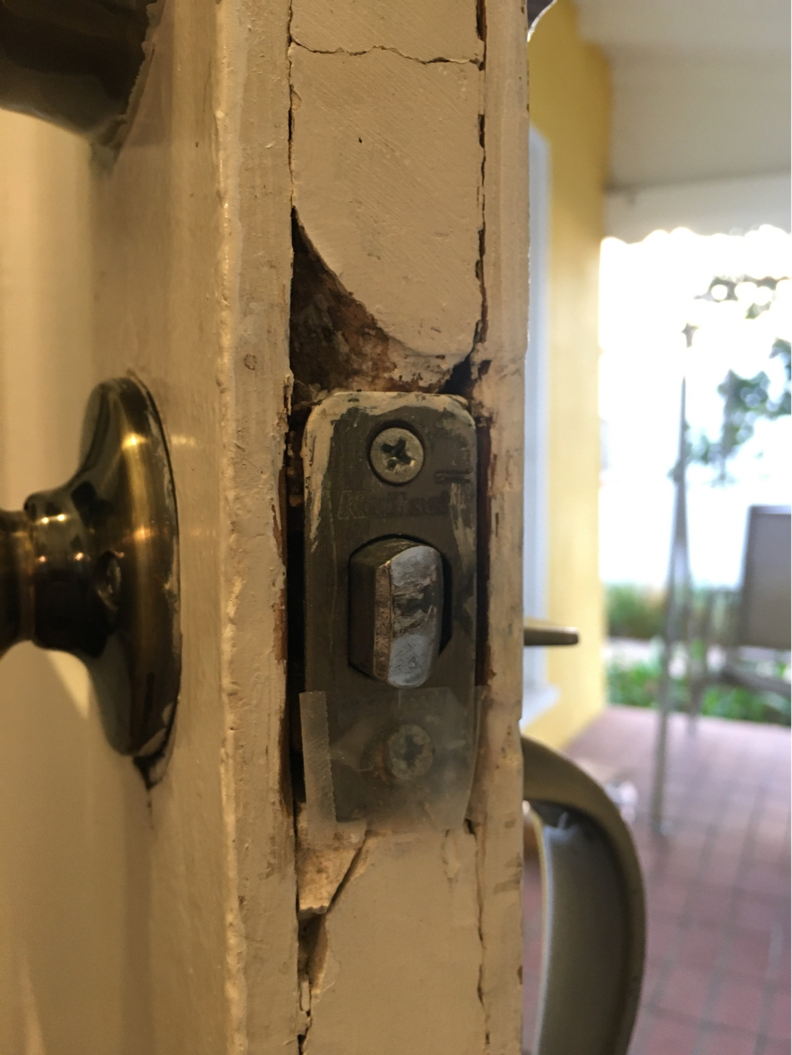 How should I fix cracking wood around door lock? Home Improvement