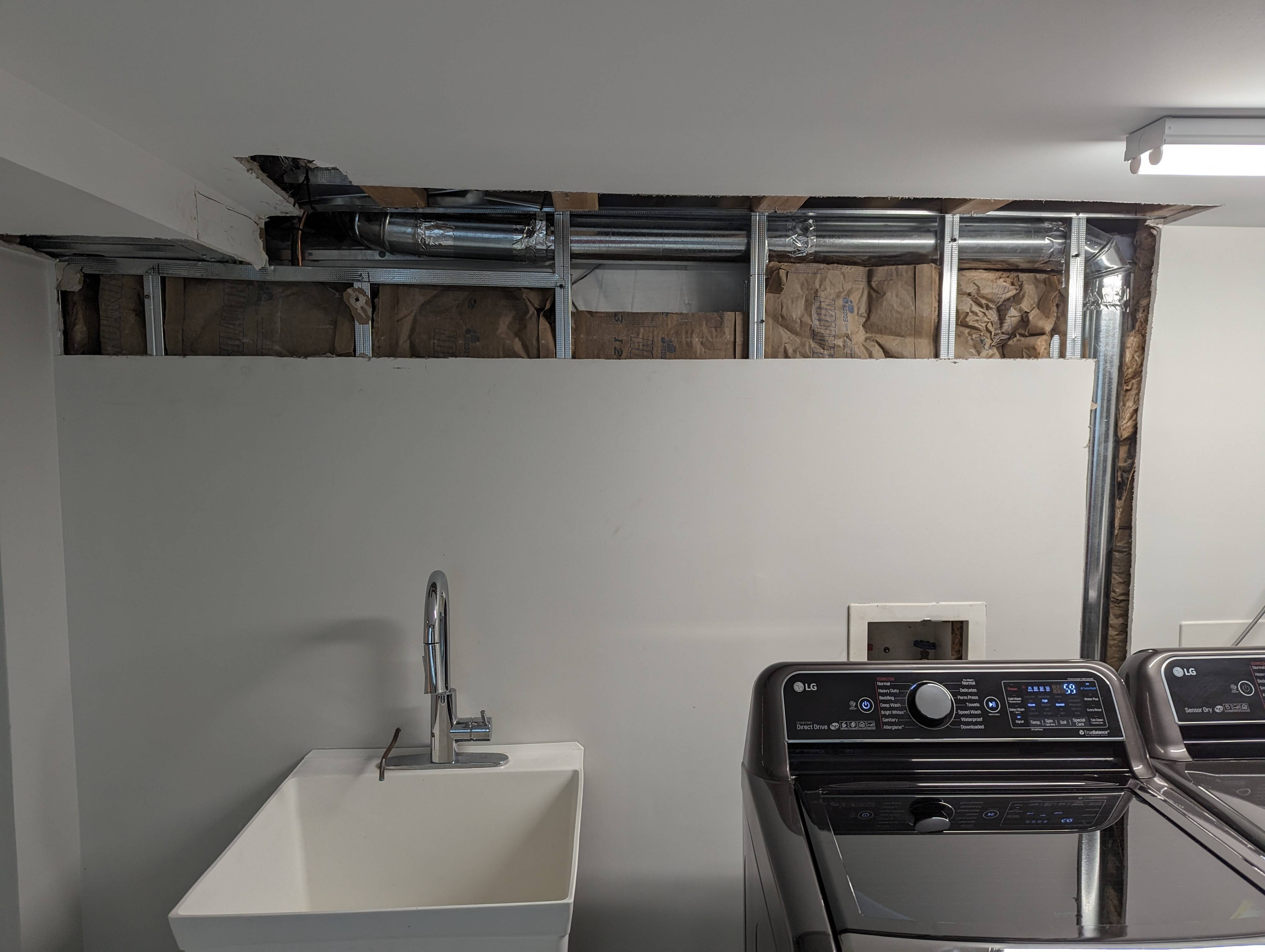 Is drywall required over our insulated laundry room wall? Home