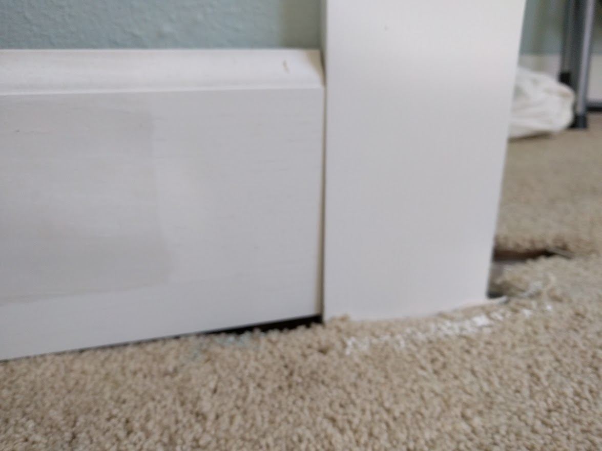 baseboard Should Door Trim/Jamb be flush cut with bottom of base for