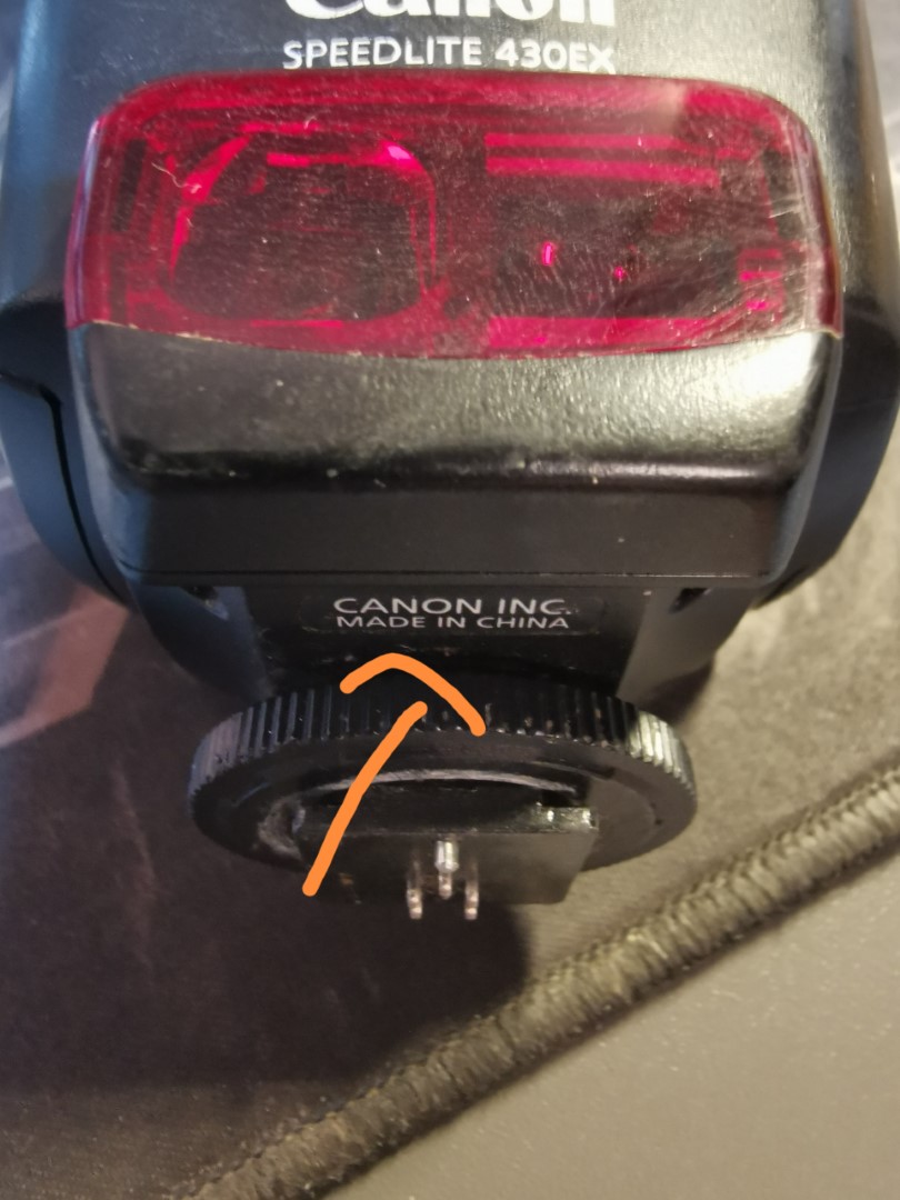 canon How to remove external flash stuck on camera body