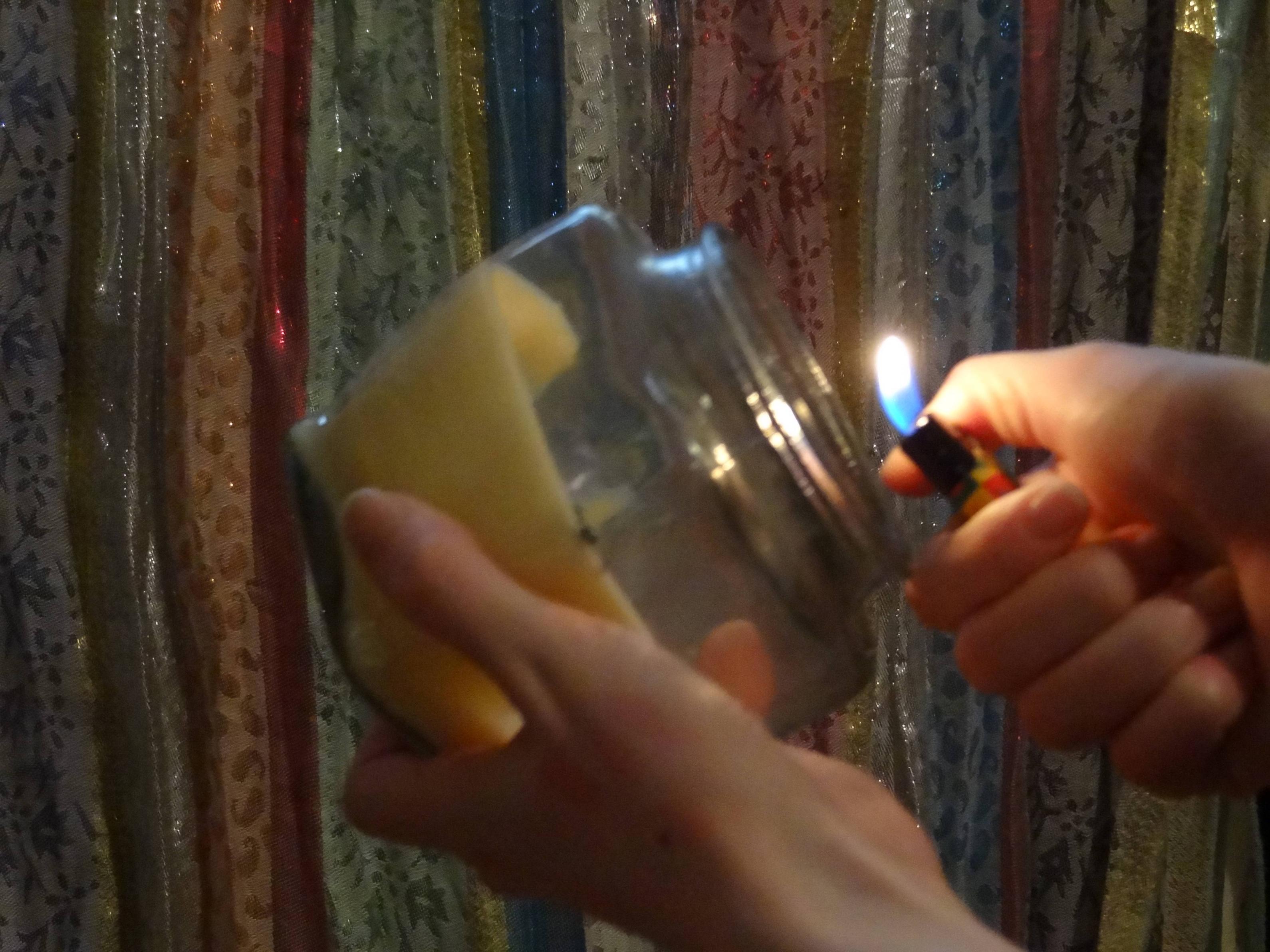 home What is the best way to light a hardtoreach candle wick