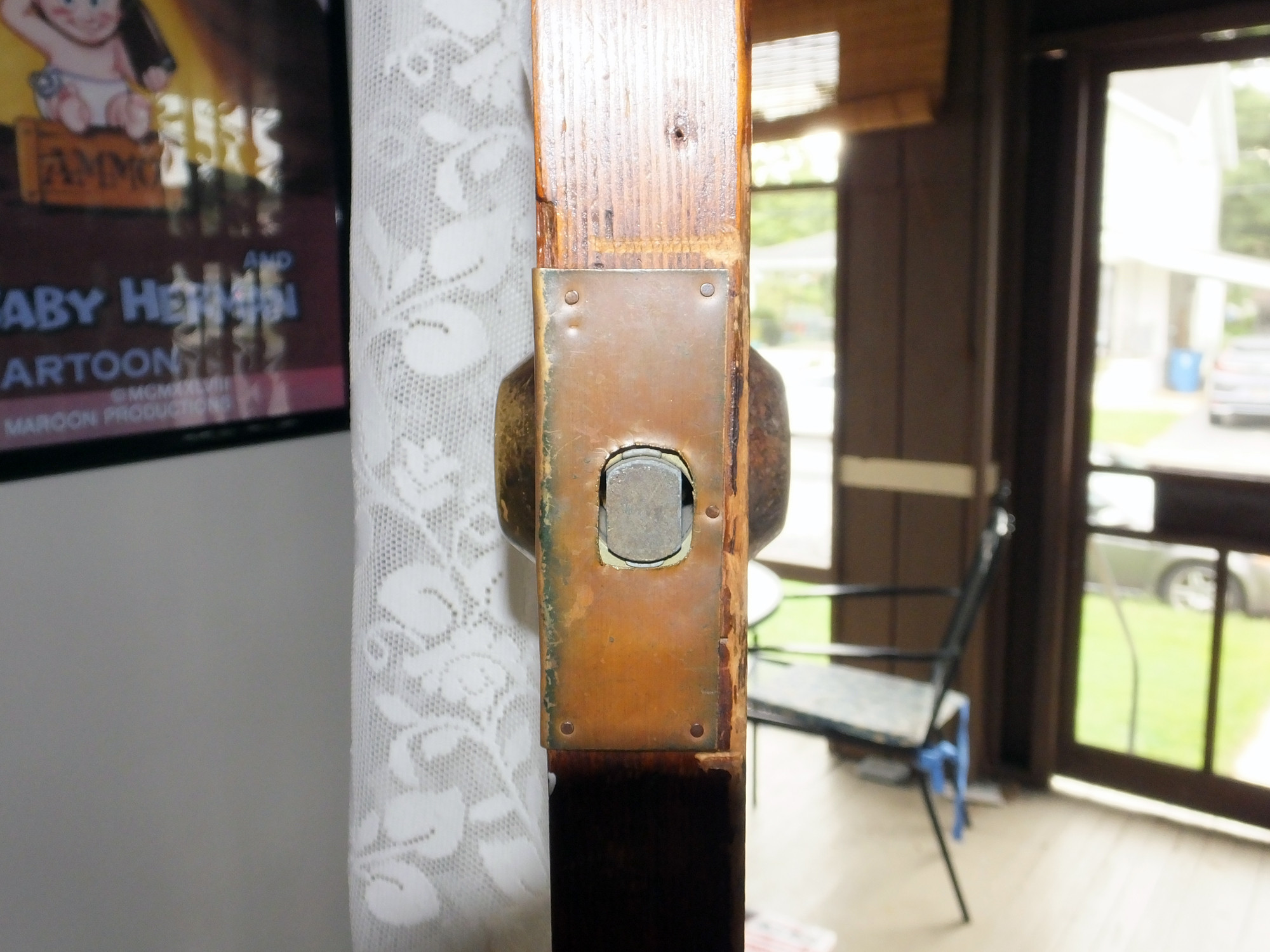 How do I remove this old Sears deadbolt with no visible screw holes