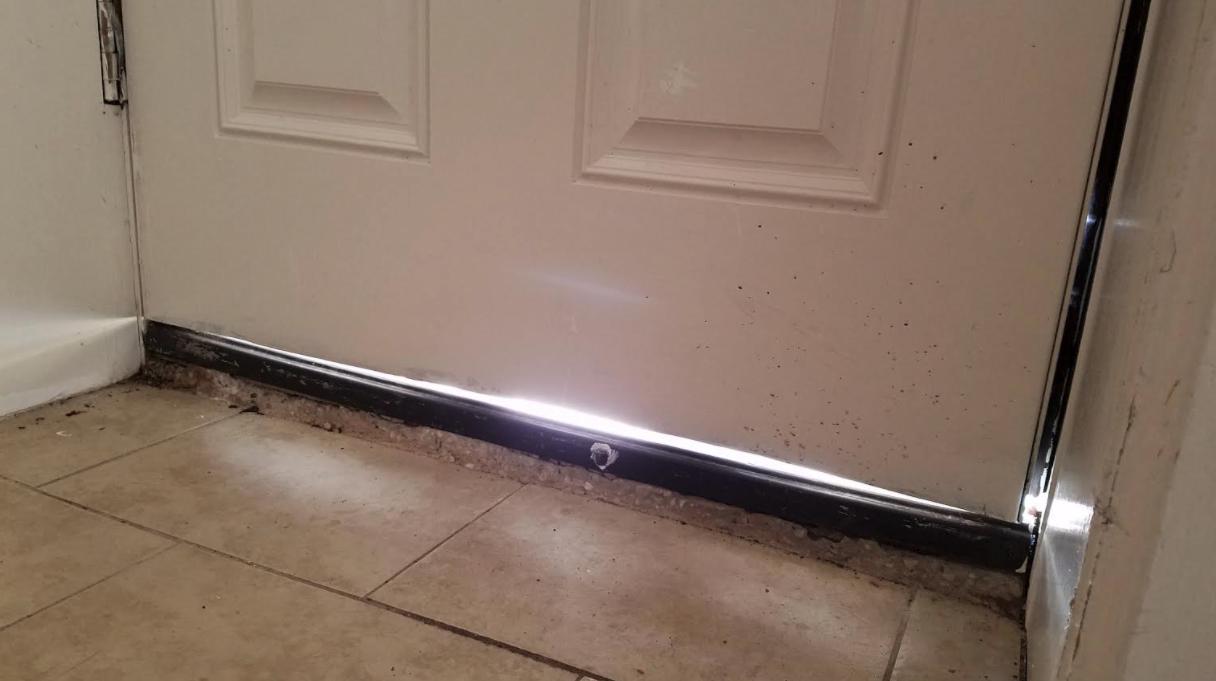 insulation - Tips for closing a gap between outside door and floor