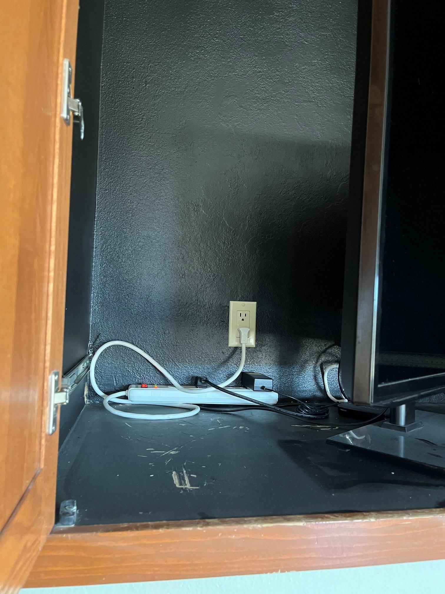 electrical How can I move an outlet from the back of an enclosed