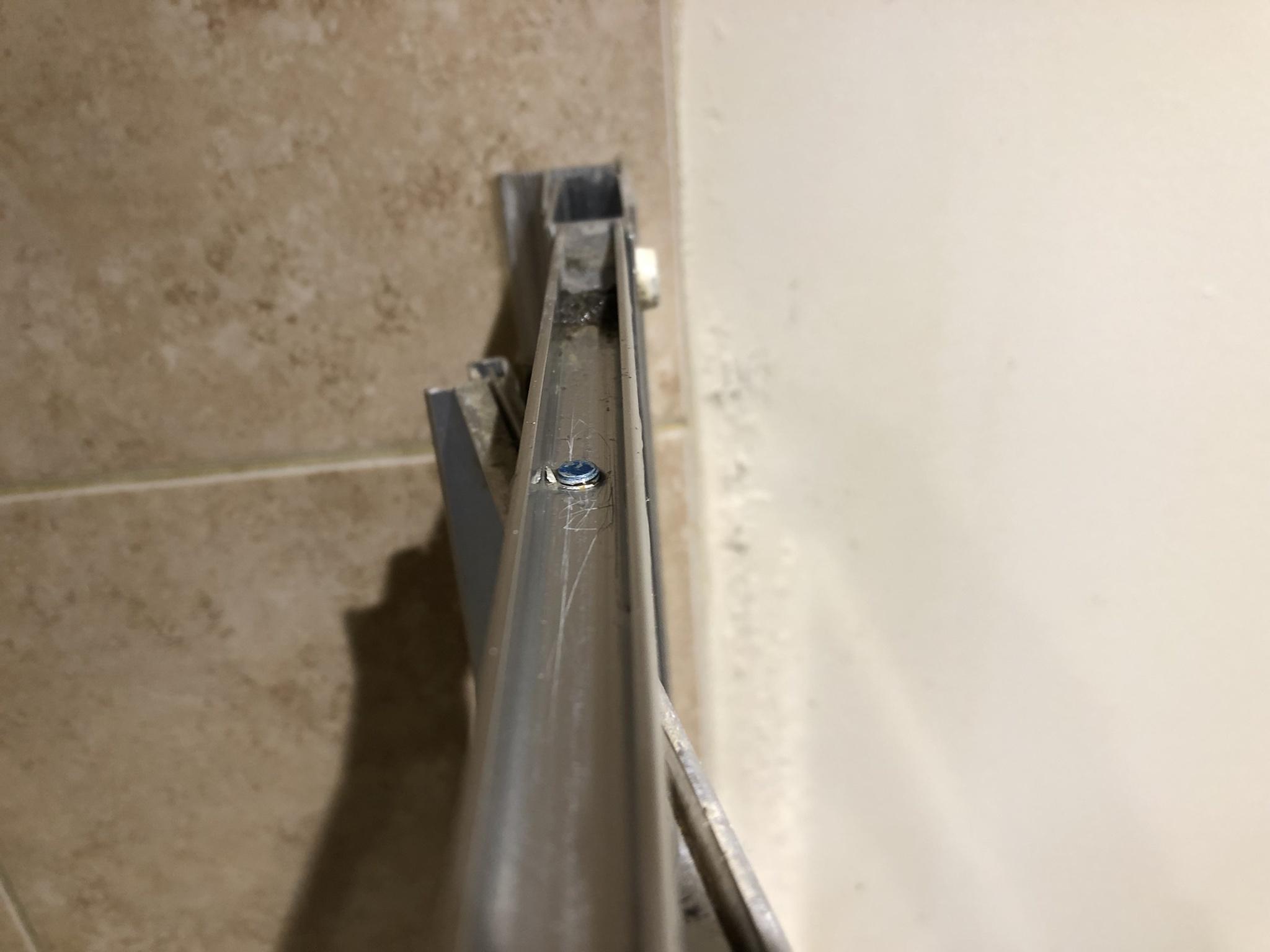 bathroom Sagging shower door with pivot point away from the wall