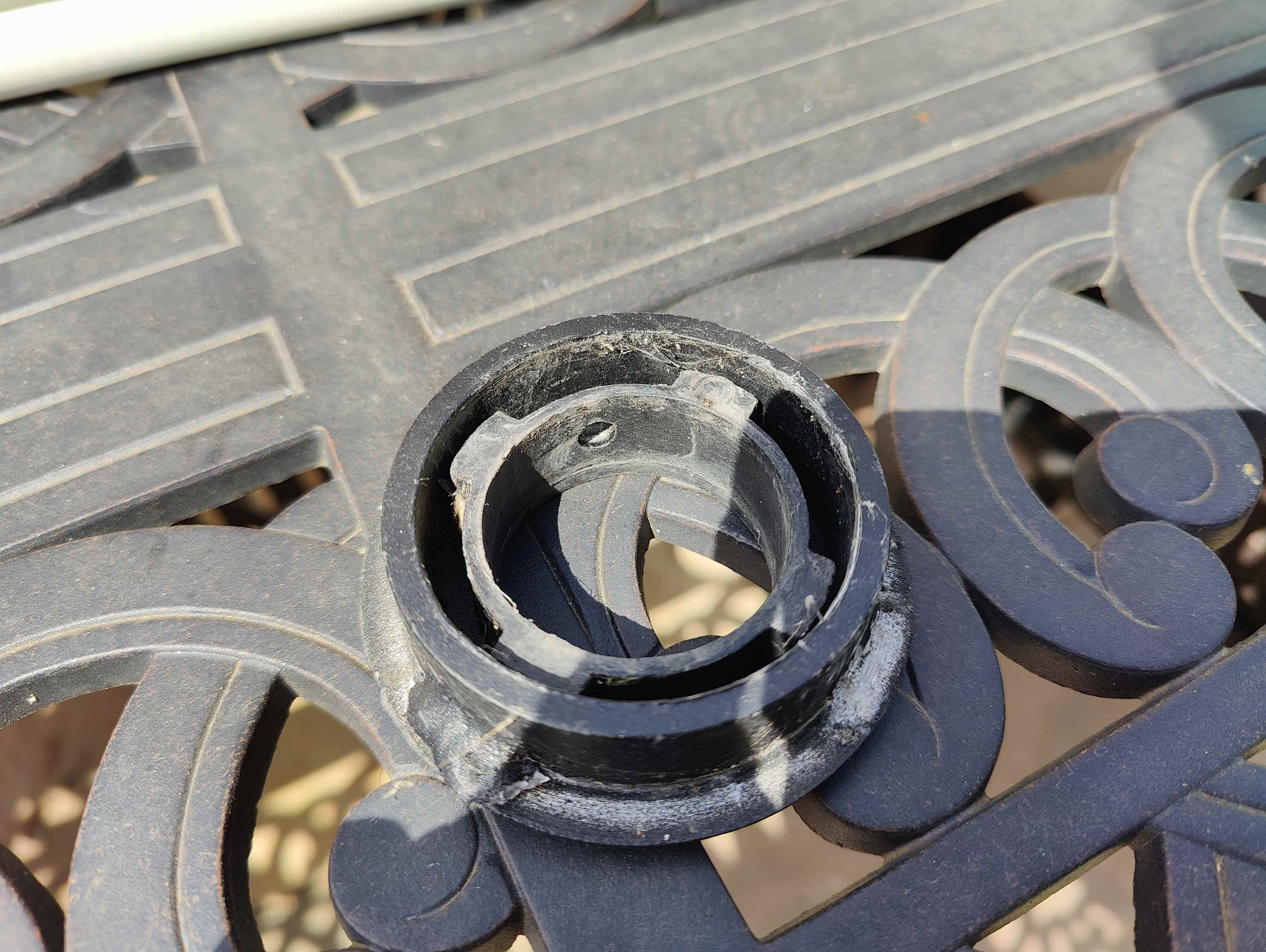 repair Fixing parasol bracket on metal garden table Home