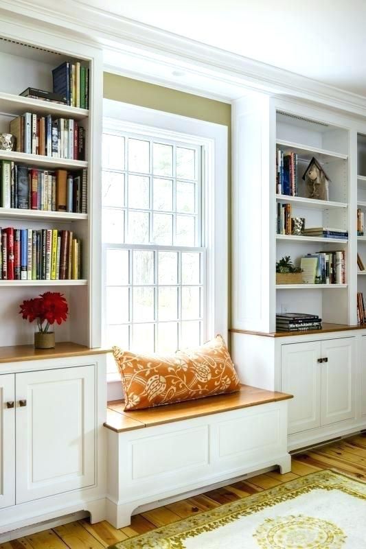 Expansion of wood countertop with built in bookshelves resting on it