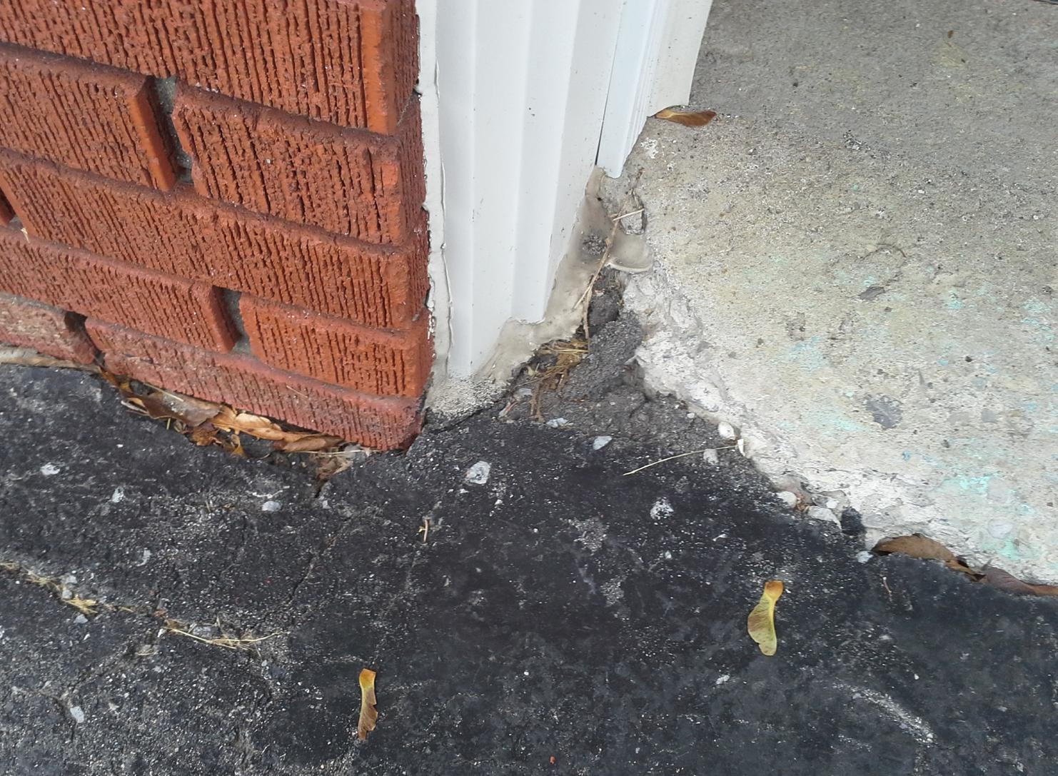 floor How do I seal the cracks between my asphalt driveway and my