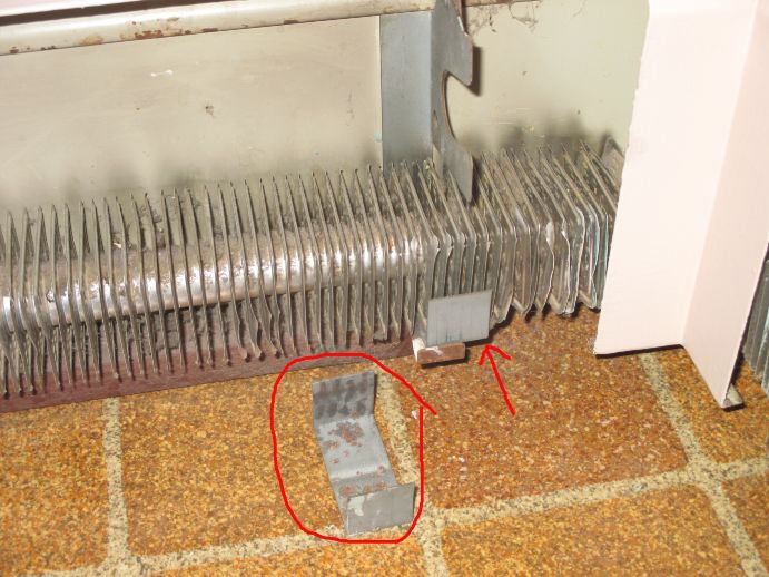 Odd metal clips on hot water baseboard Home Improvement Stack Exchange