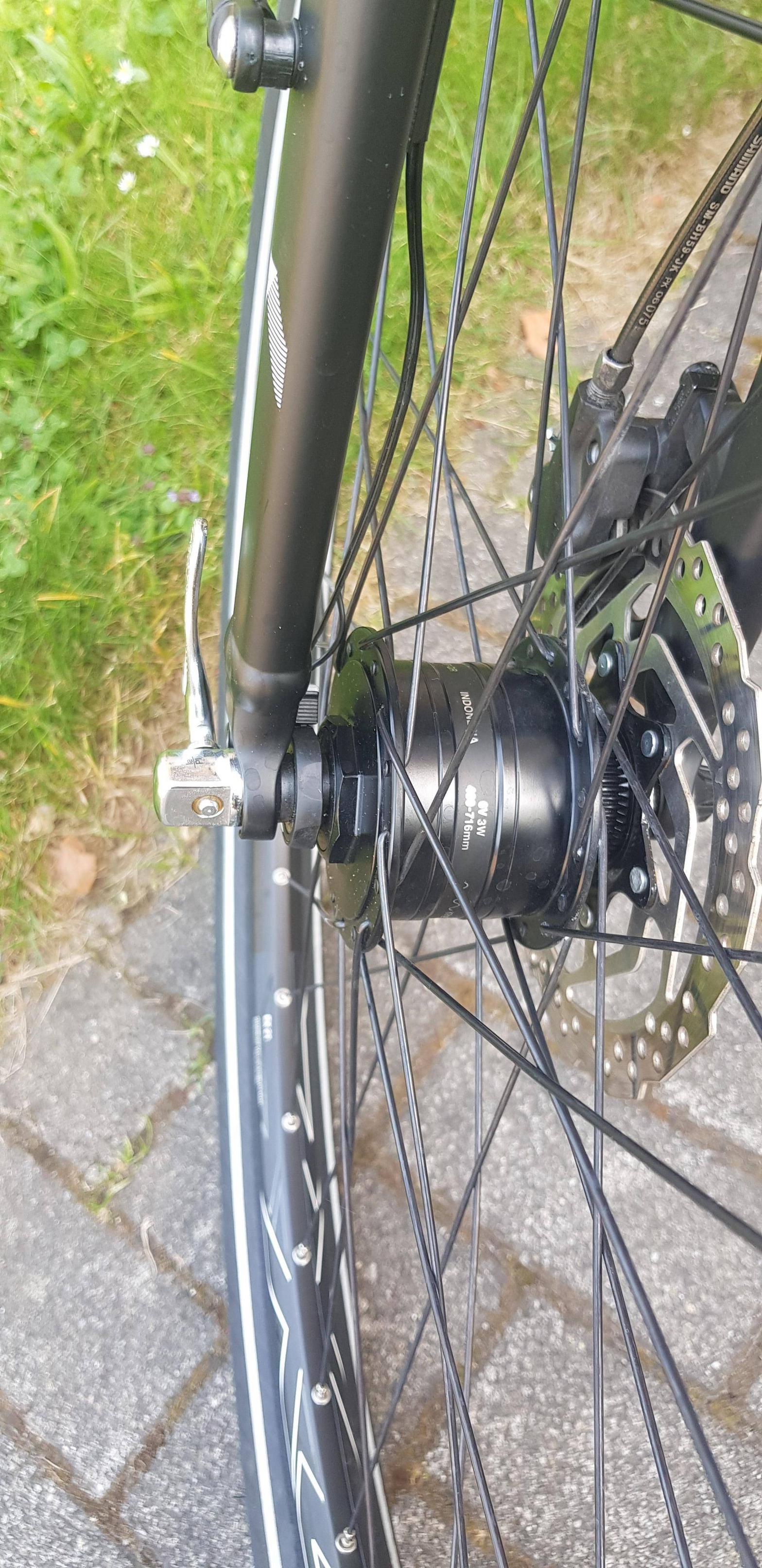 repair Front wheel is not aligned and touching the brake line