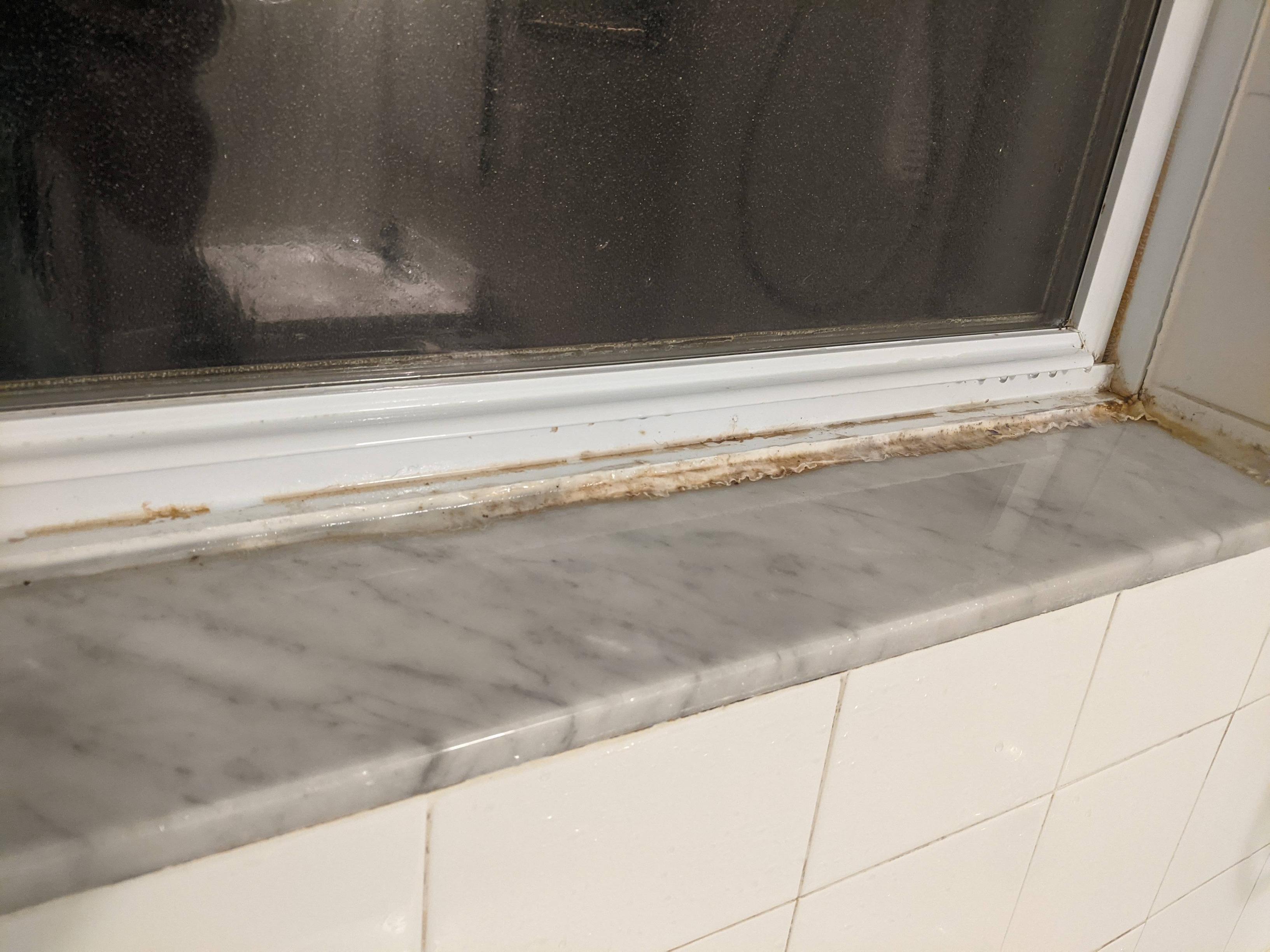 How can I properly caulk a vinyl window to a marble sill, inside a shower? Home Improvement
