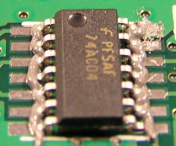 surface mount How do I prevent bridges while soldering SMD Components