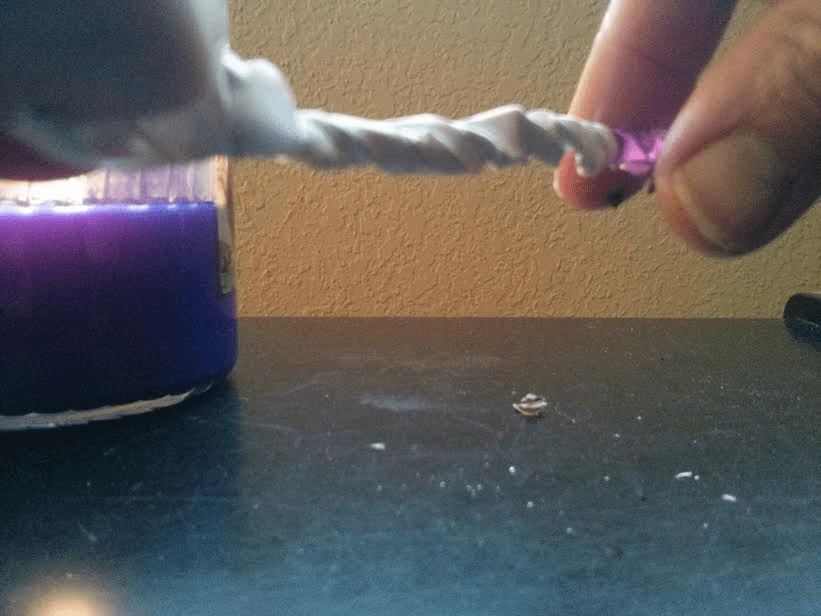 home What is the best way to light a hardtoreach candle wick