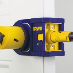 How do I drill a 2⅛ inch door knob hole over an existing 1½ inch hole