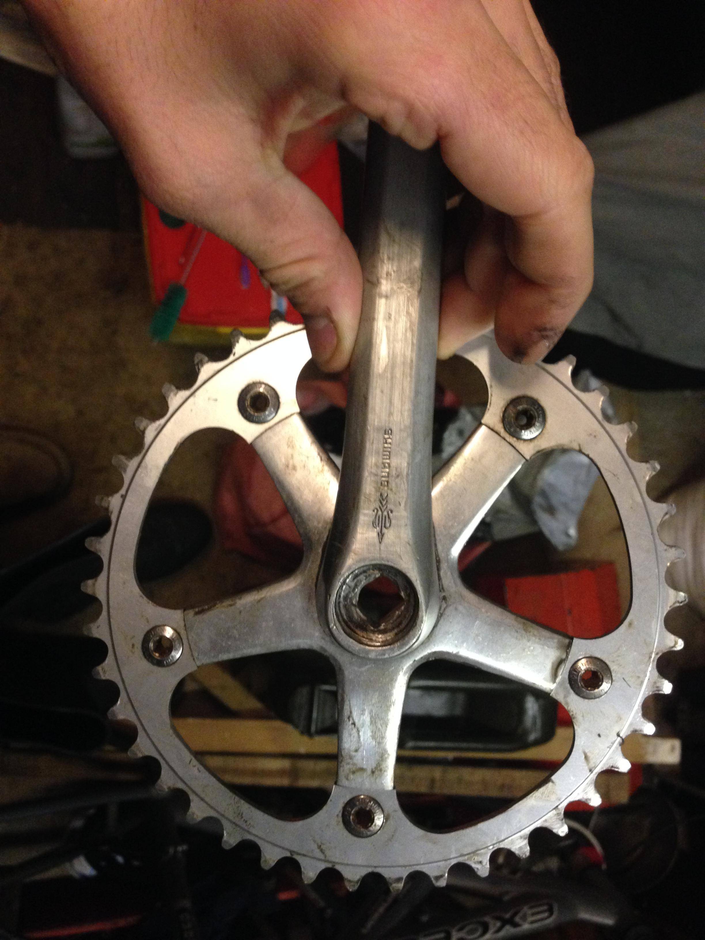 My crankset stops the pedals from turning when I tighten it onto the