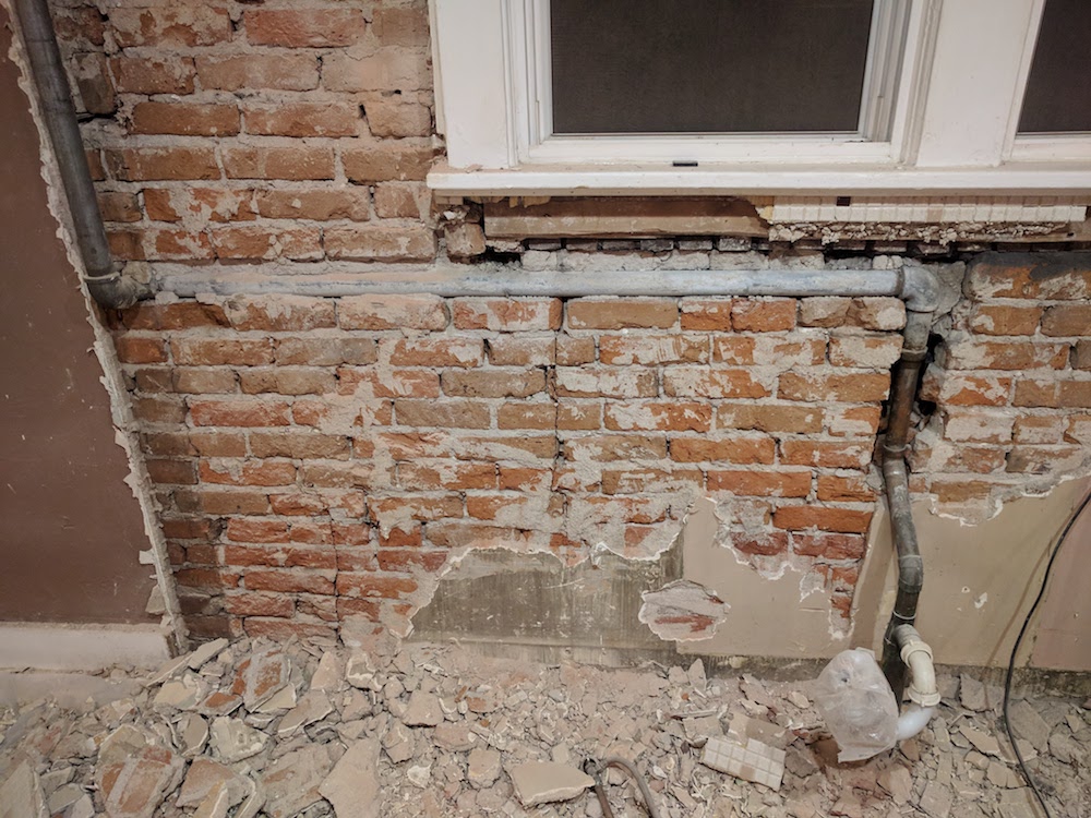 Options for interior brick walls damaged by rotary hammer Love